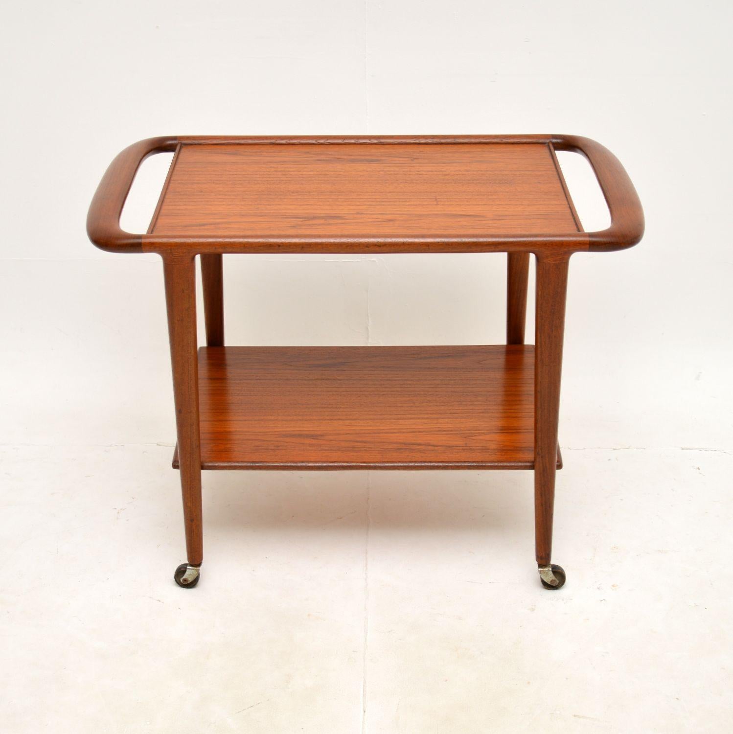 A very stylish and extremely well made Danish vintage teak drinks trolley by Niels Moller. This was made in Denmark by JLM Mobelfabrik, it dates from the 1960’s.

It is of superb quality and is beautifully designed, with lovely curved edges and