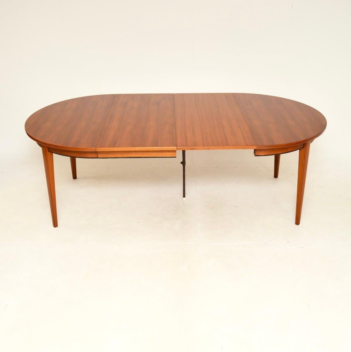 A stunning Danish vintage teak extending dining table by Gunni Omann. It was manufactured by Omann Jr, it dates from the 1960’s.

This is of superb quality, it is extremely stylish and very practical. It has two additional leaves, it extends from a
