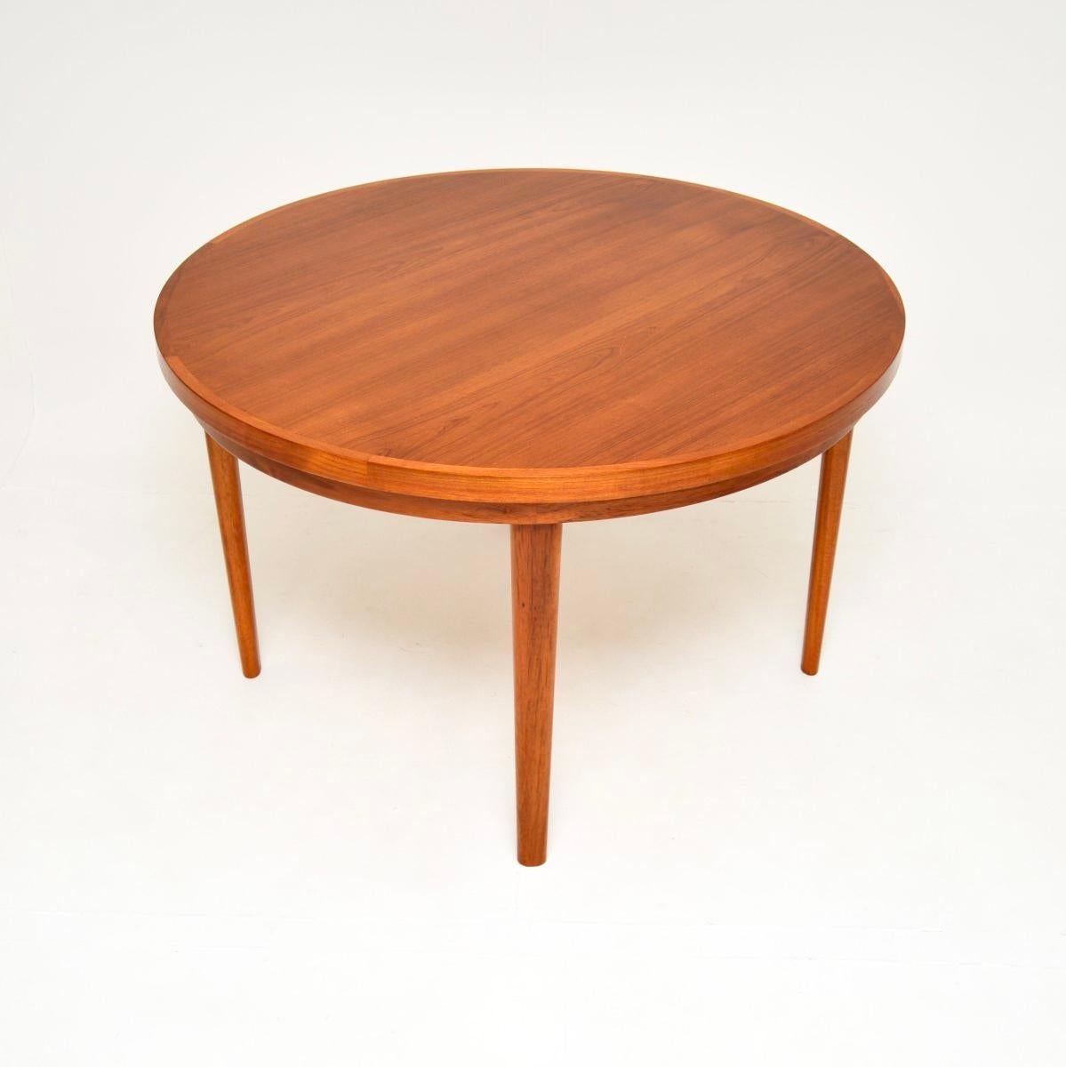 An absolutely stunning and iconic Danish vintage teak Flip Flap Lotus dining table by Dyrlund. This was made in Denmark, it dates from the 1960’s.

This is a superb quality table with a fantastic design. When closed the circular top can seat four,