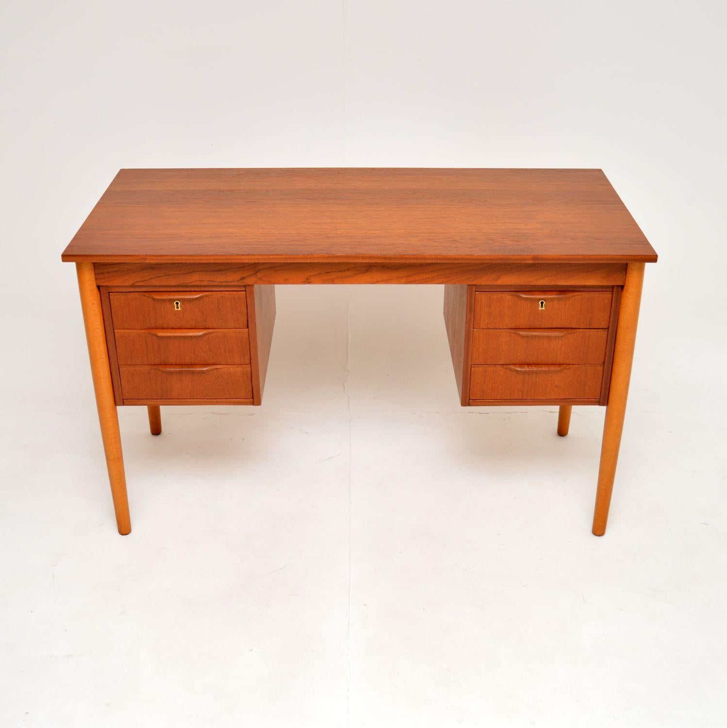 A stylish and useful Danish vintage teak pedestal desk. This was made in Denmark, it dates from the 1960’s.

It is of great quality and is beautifully designed. This has a nicely finished back so can be used as a free standing item, the three