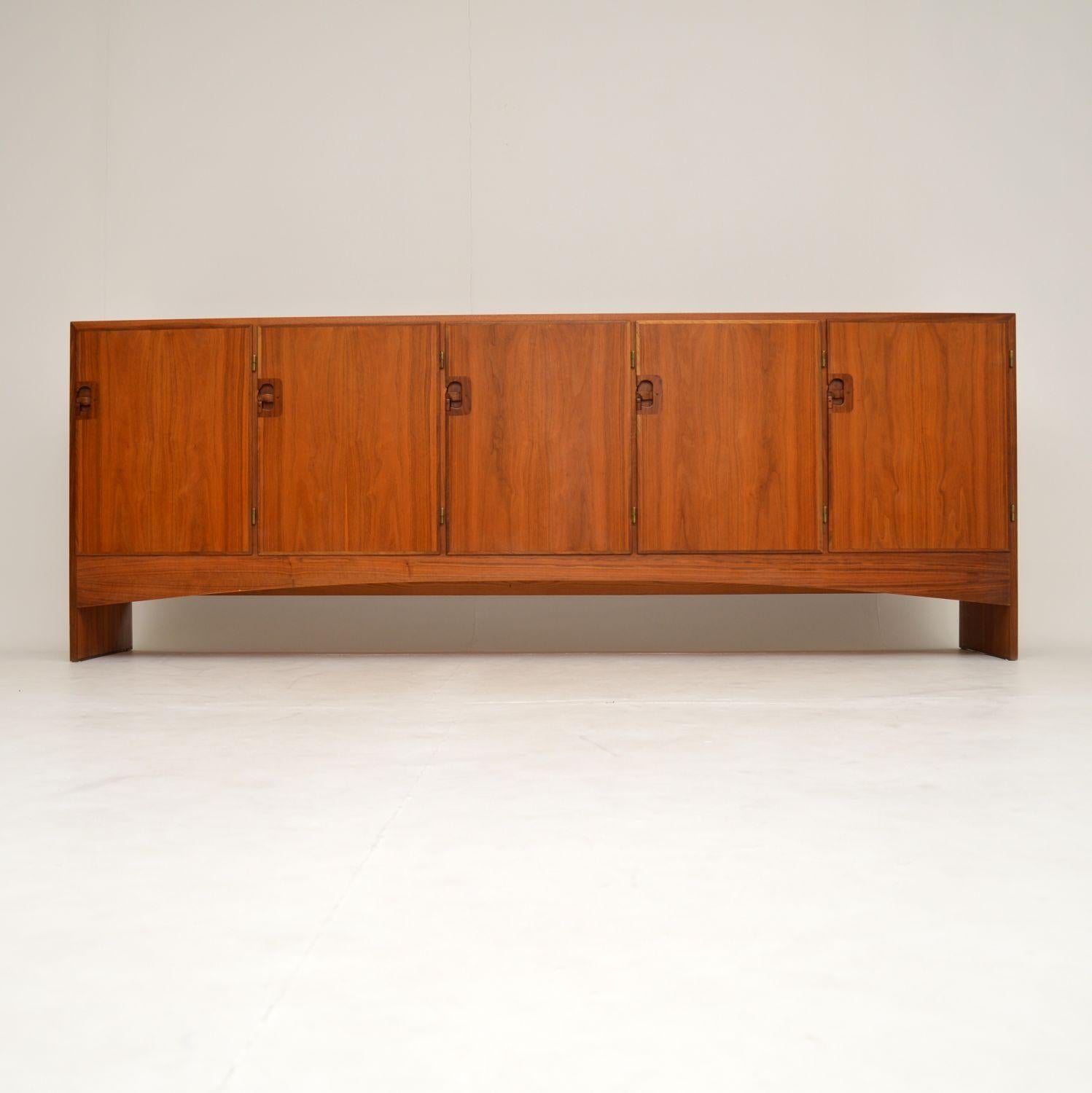 A stunning and very impressive vintage Danish sideboard in teak. This was designed by Harry Ostergaard, it was made by Randers and dates from the 1960s. It has a stunning color and amazing grain patterns, it looks like it never saw the light of day