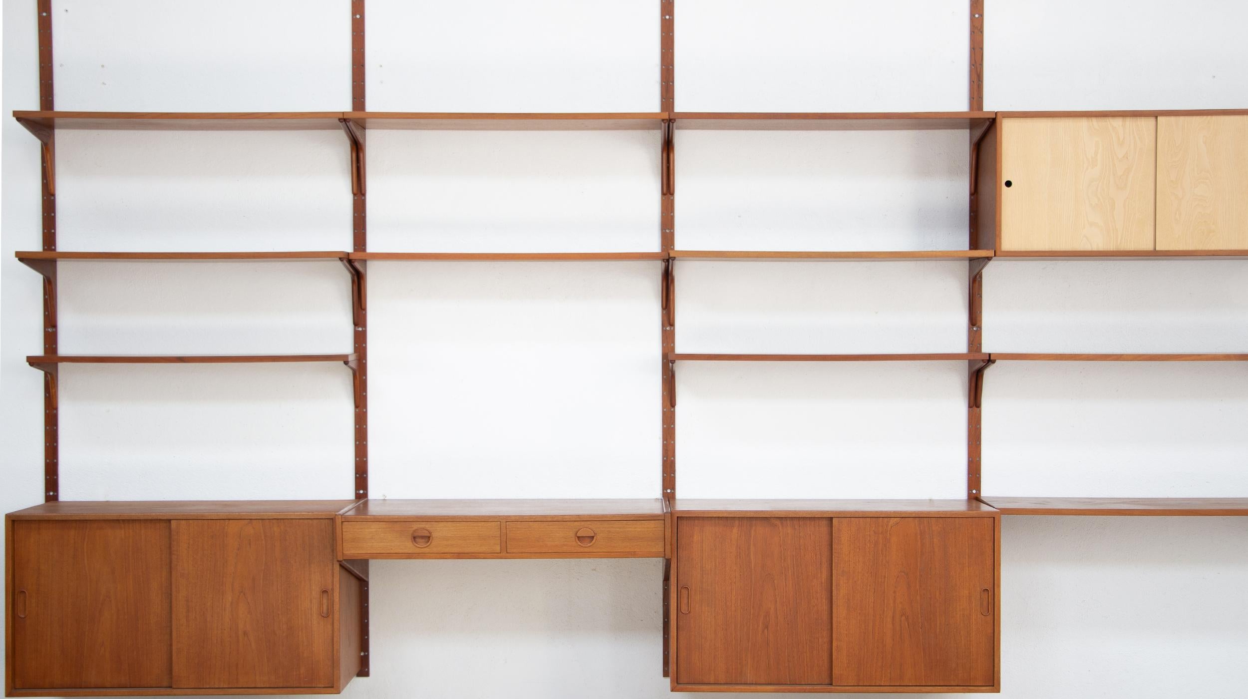 Vintage teak bookcase by Rud Thygesen and Johnny Sorensen for Danish publisher Hansen and Guldborg (HG) Furniture.

Stamped with the 