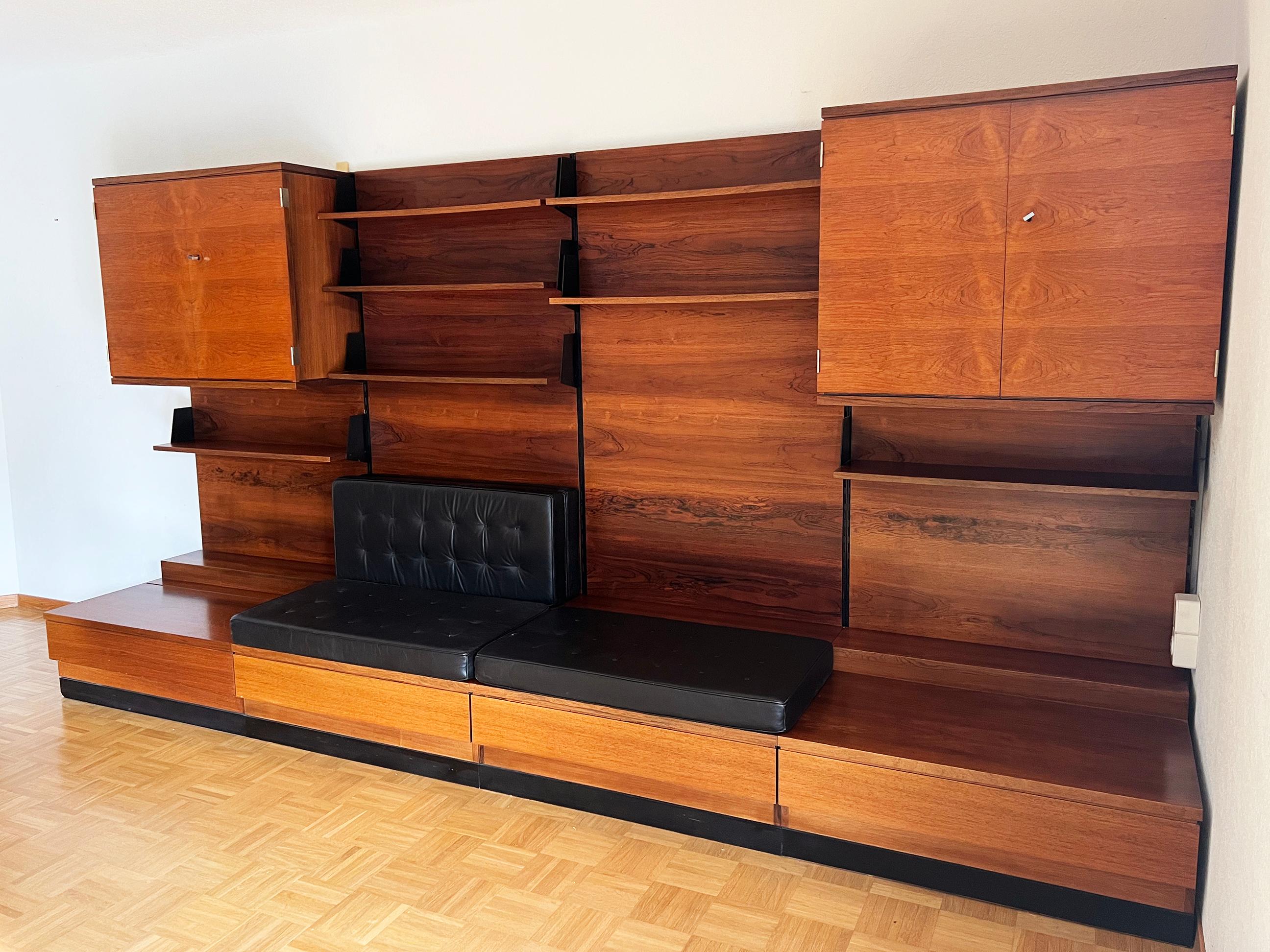 Priced for the entire set! Truly a one-of-a-kind and extremely rare piece.

This is a truly incredible, one-of-a-kind modular teak wall system that can be customized, and set up however you would like! There are four panels, onto which shelving and