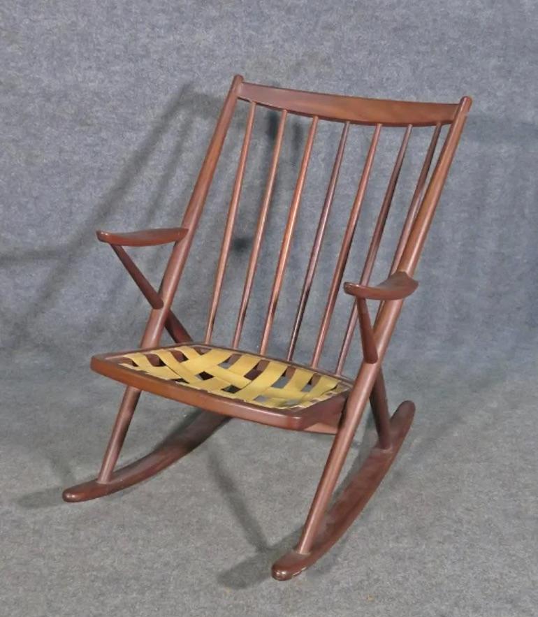 With a rich teak frame and spindle back design, this vintage Danish rocker is beautifully made with mid-century quality. 
Please confirm item location with seller (NY/NJ).