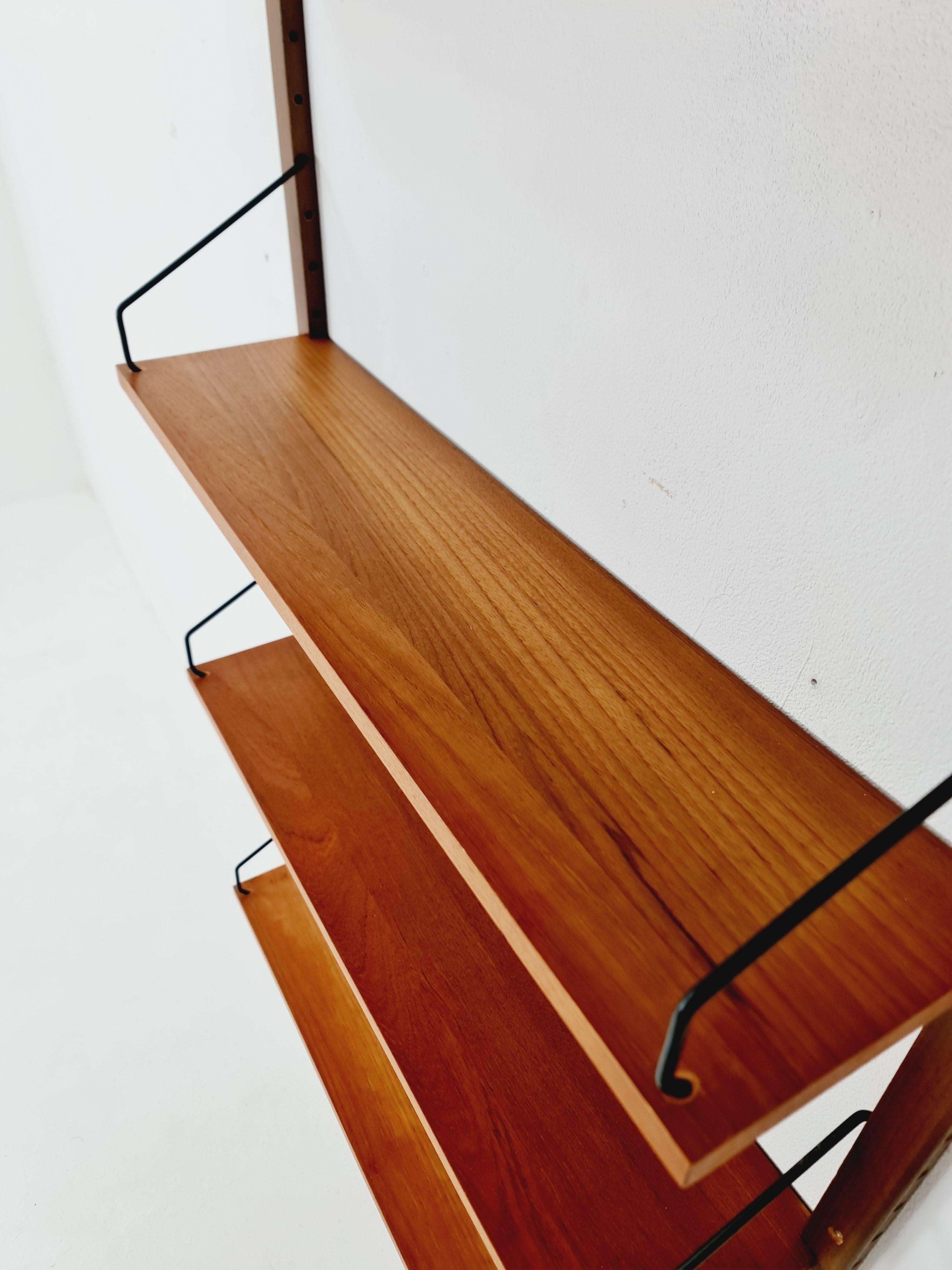 Danish walnut Wall-Mounted Shelving Unit, by Royal for  Poul Cadovius, 1960s 1