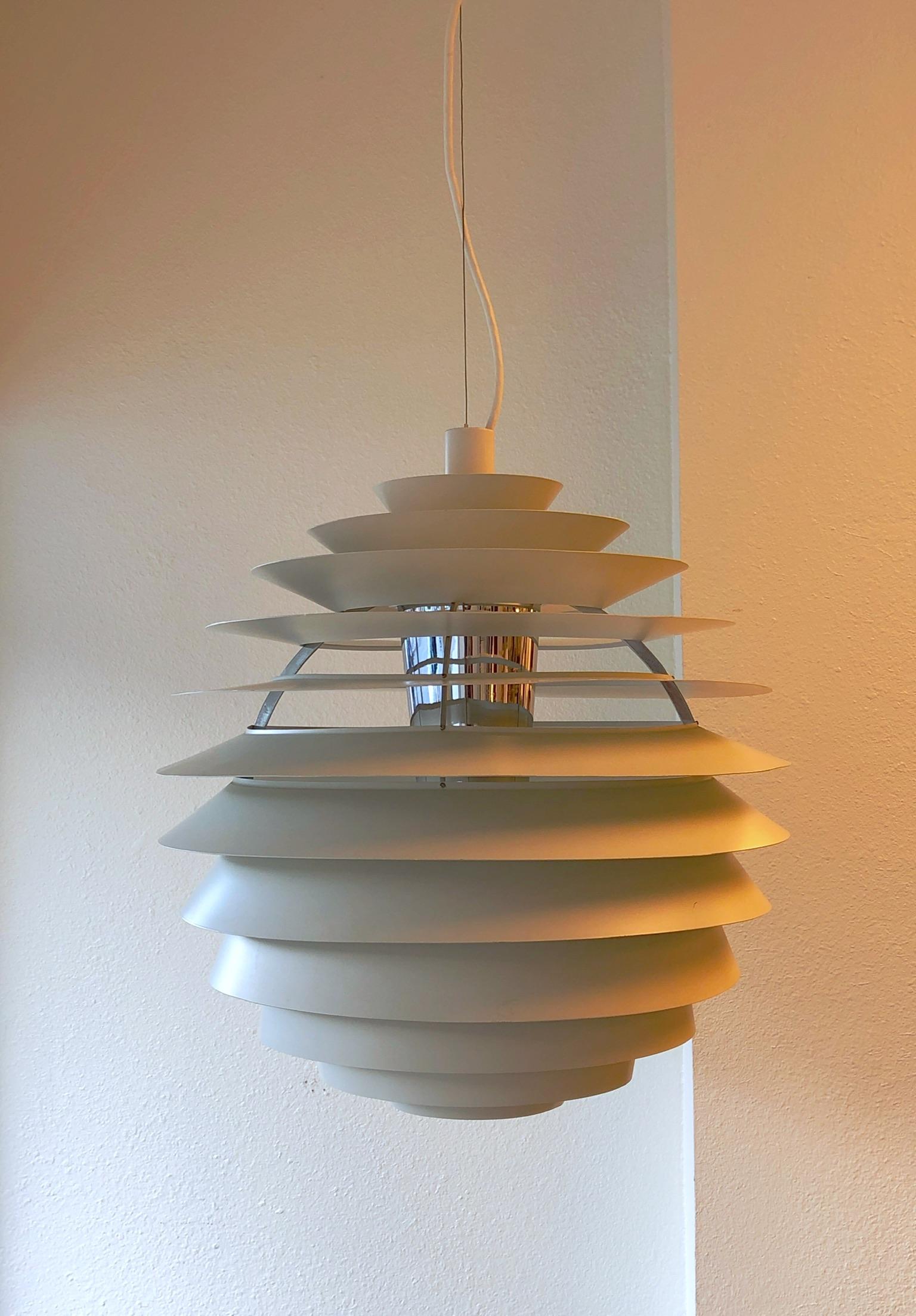 Original off white and polish chrome PHL pendant lamp by Danish designer Poul Hennissen for Louis Poulsen design in 1957. It’s in original condition, retains all the labels from 1957 and ceiling cap. 

Measurements: 25.6” high and 23.6”