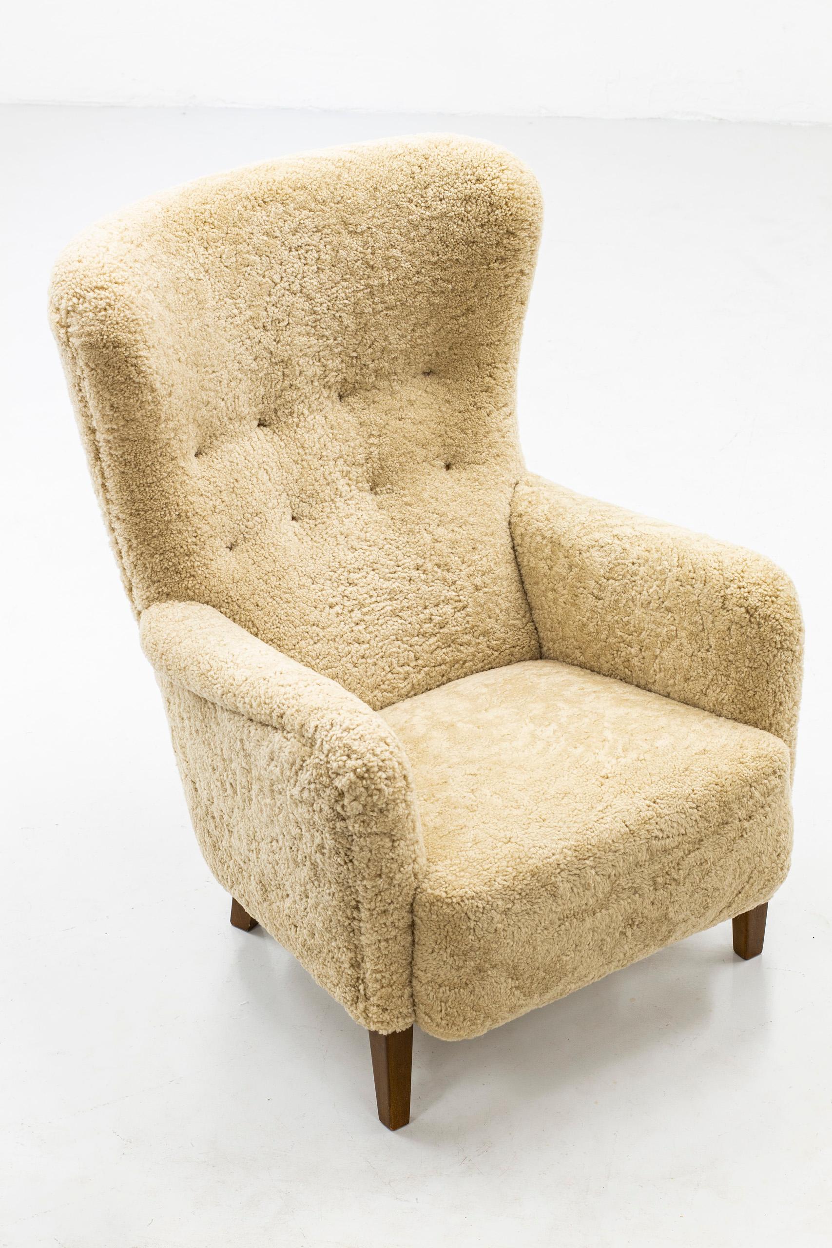 Mid-20th Century Danish Wing Back Chair with Sheep Skin in the Manner of Frits Henningsen
