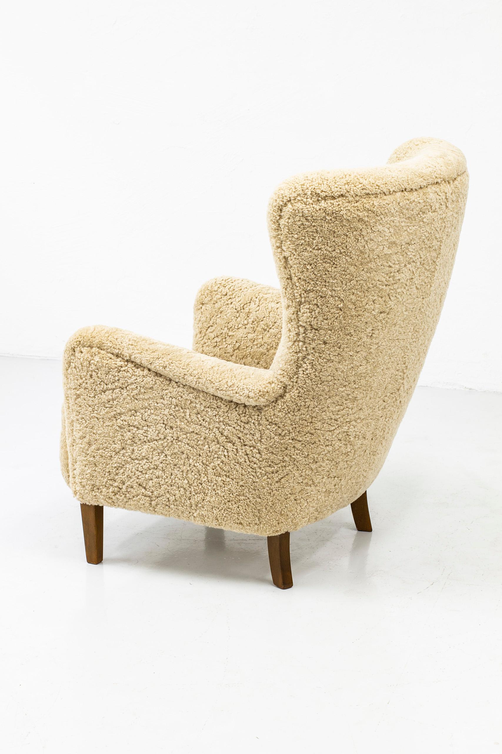 Danish Wing Back Chair with Sheep Skin in the Manner of Frits Henningsen 1