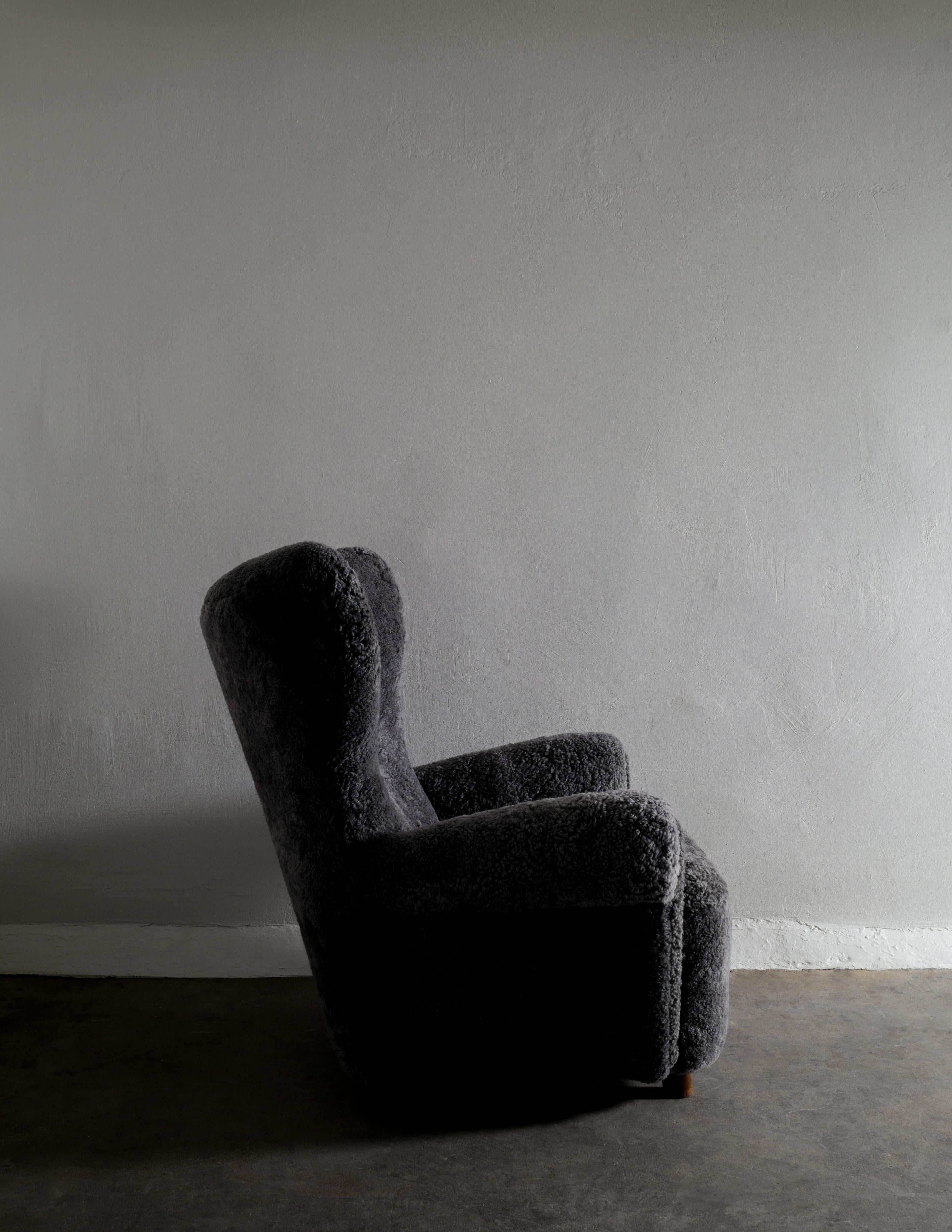 Scandinavian Modern Danish Wingback Arm Chair in Dark Grey Sheepskin Produced in Denmark ca 1940s
