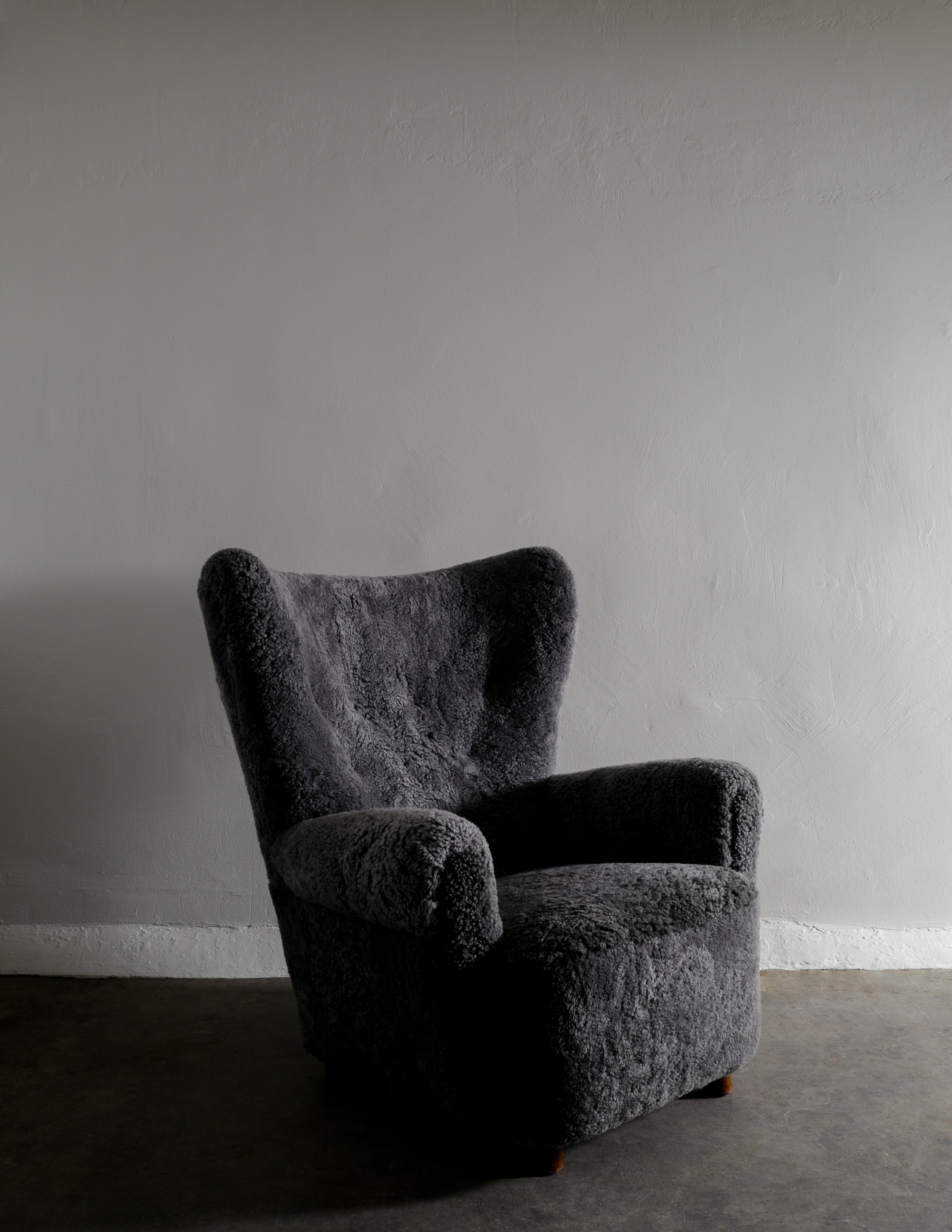 Danish Wingback Arm Chair in Dark Grey Sheepskin Produced in Denmark ca 1940s 1