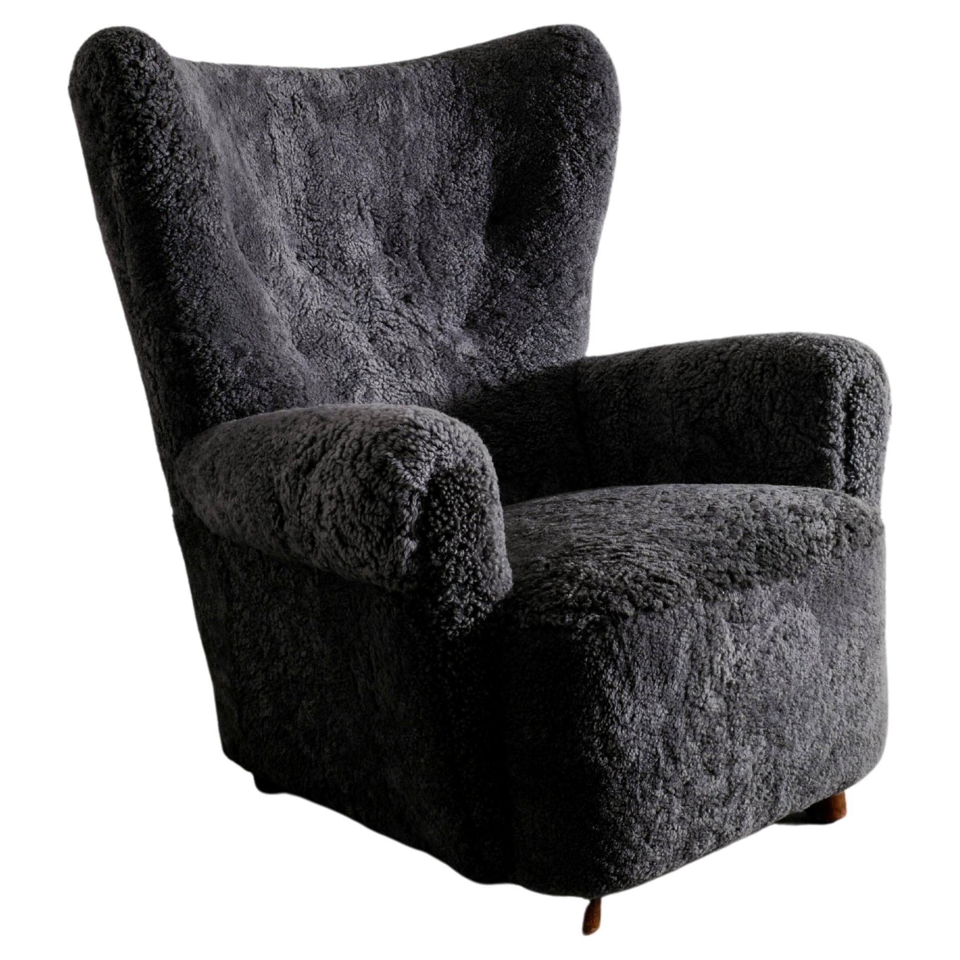 Danish Wingback Arm Chair in Dark Grey Sheepskin Produced in Denmark ca 1940s