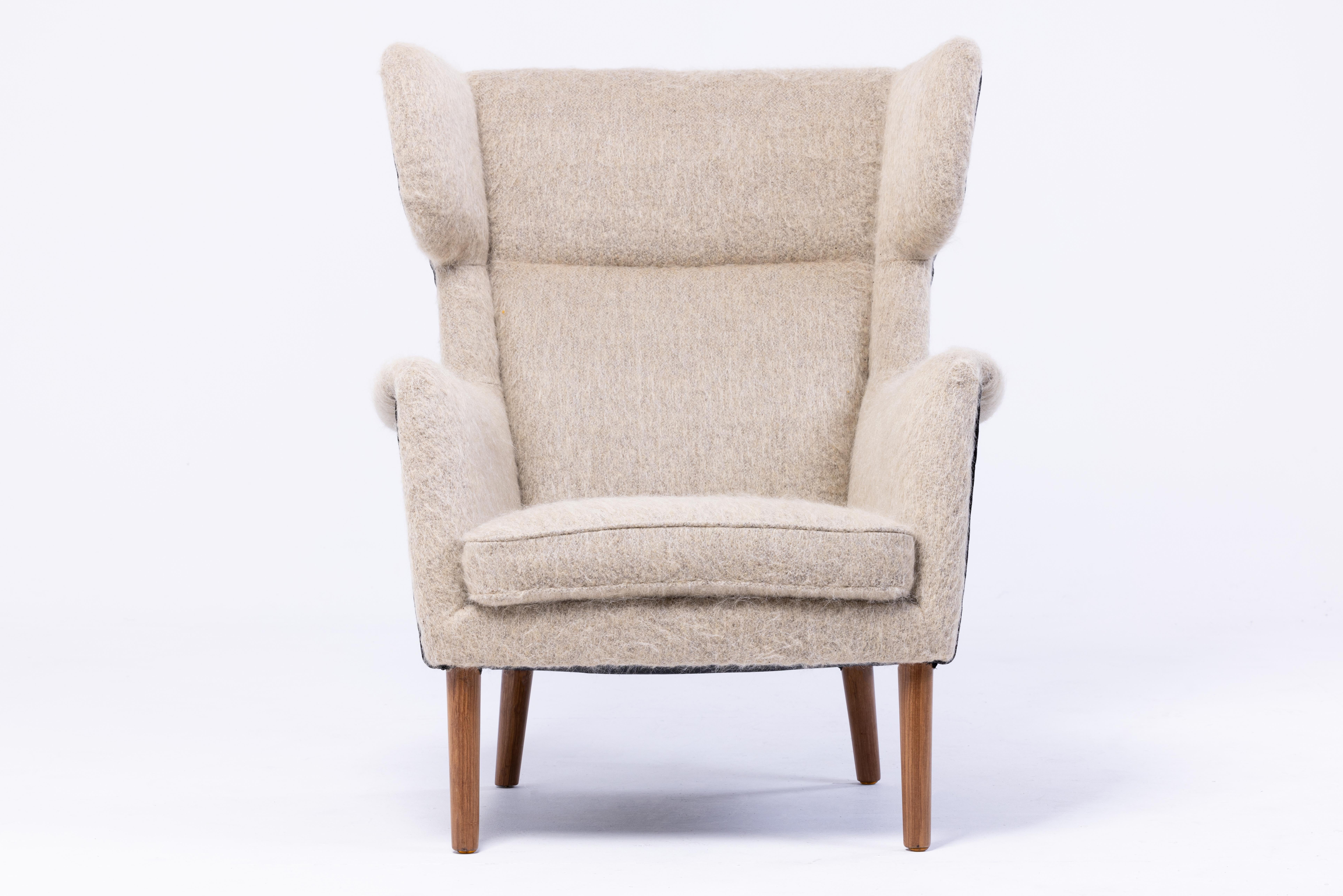Splendid wingback armchair, Denmark 1950s, entirely restored and reupholstered with a velvet by Hèrmes and a mohair and alpaca fabric by Pierre Frey (Yeti), legs in teak wood.
