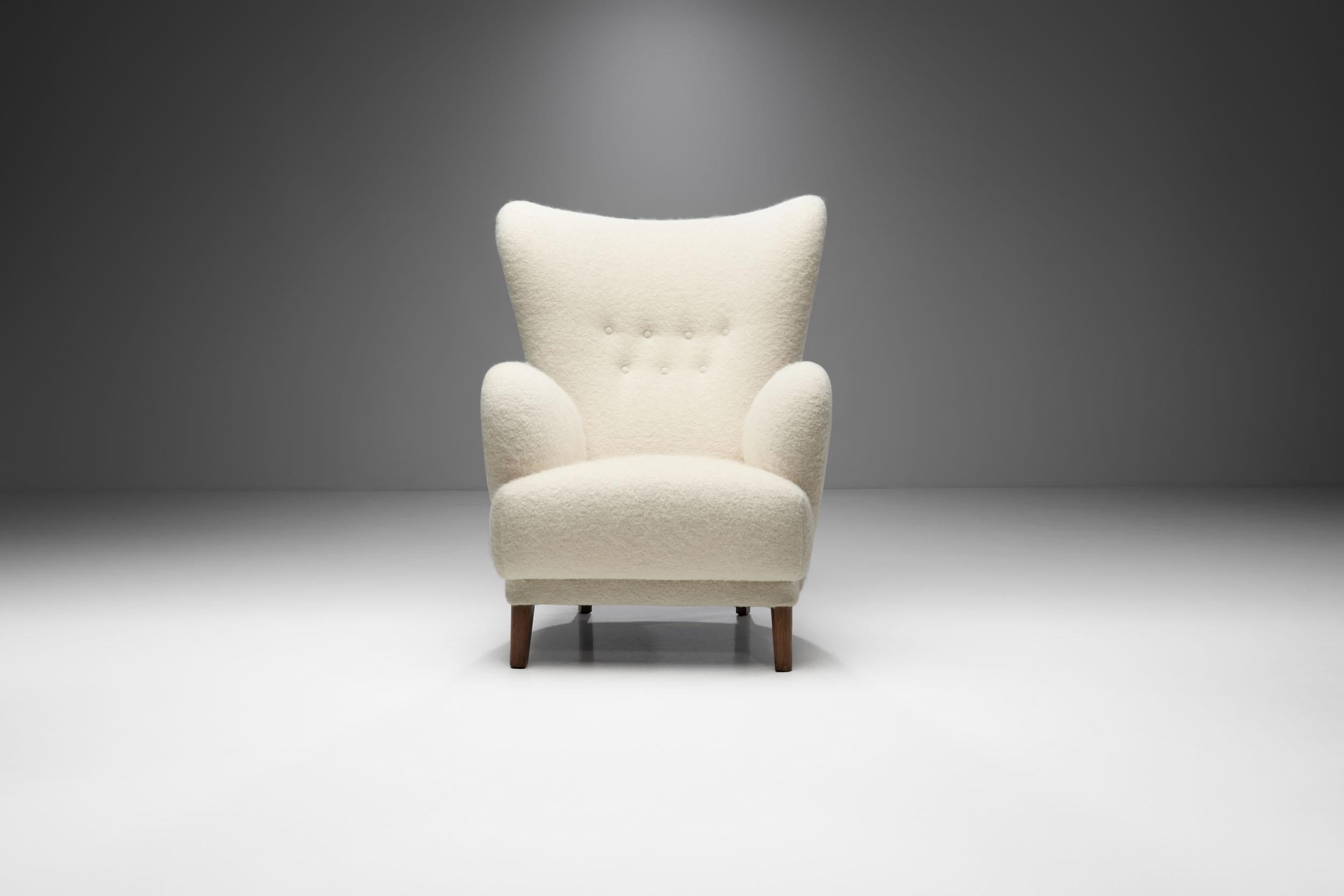 Mid-20th Century Danish Wingback Chair with Stained Beech Legs, Denmark, 1940s