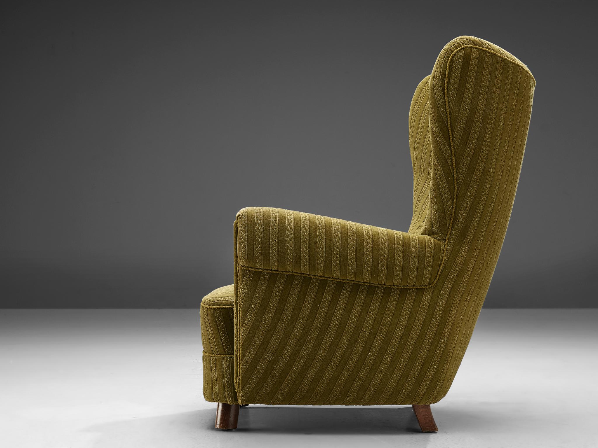 green wing back armchair