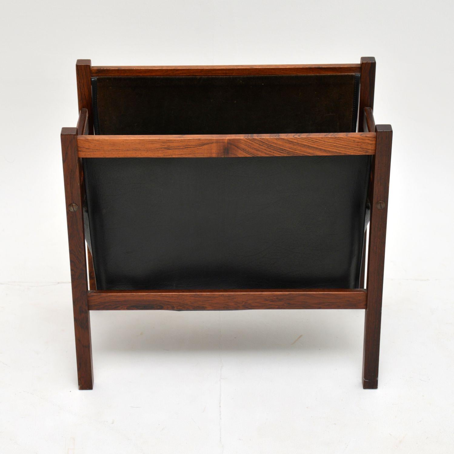 A stunning vintage paper rack in wood and leather. This was made in Denmark, it dates from circa 1960s.

It is in super condition for its age, with only some extremely minor wear. The wood is all clean and sturdy, with a beautiful colour and