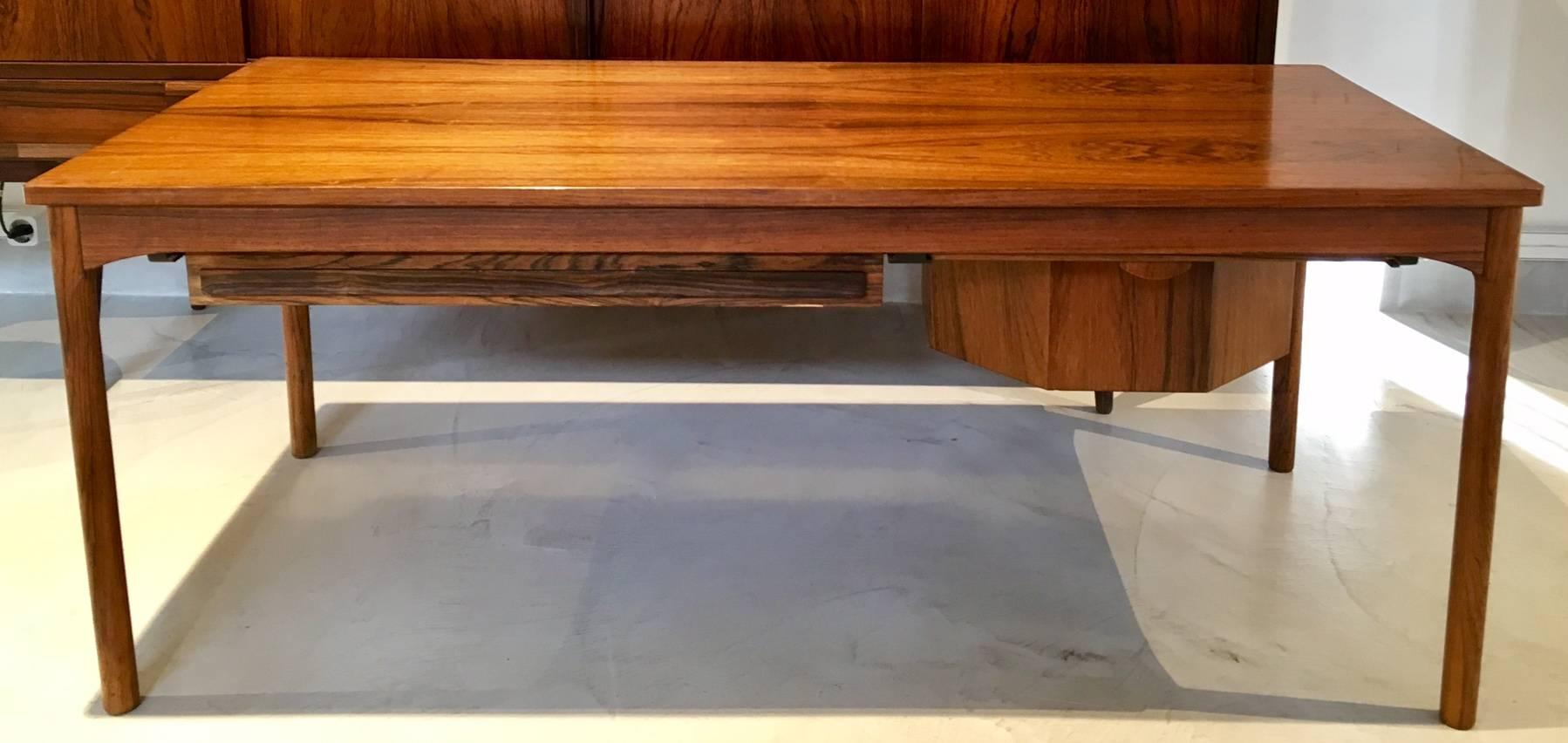Wooden table with side stretcher and two drawers originally meant for knitting and handicraft materials. Suitable to use as a coffee table. Minor stains and scratches on the tabletop.