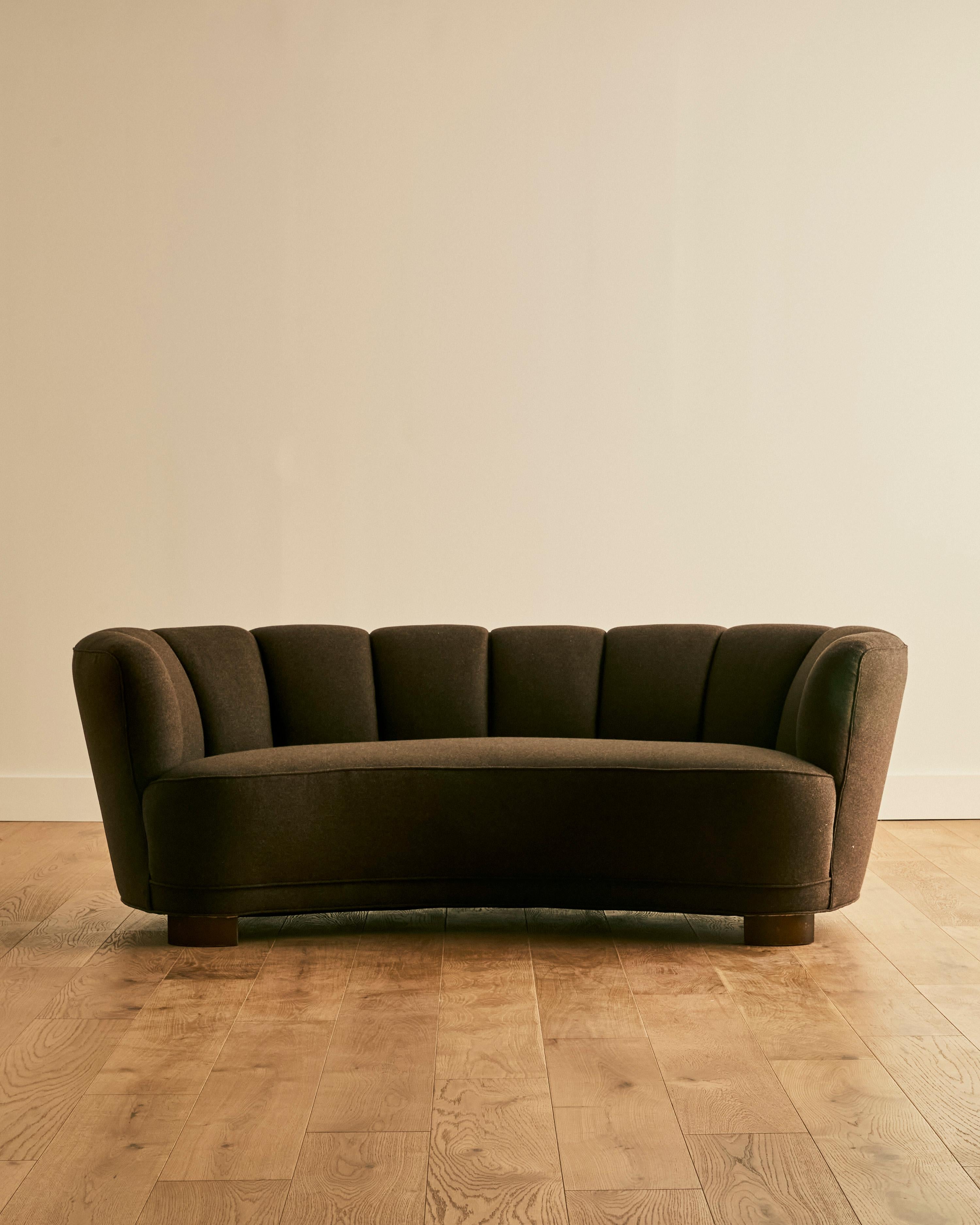 Danish wool banana sofa attributed to Viggo Boeson, newly reupholstered in Kravet Couture earthy espresso heavy wool felt.