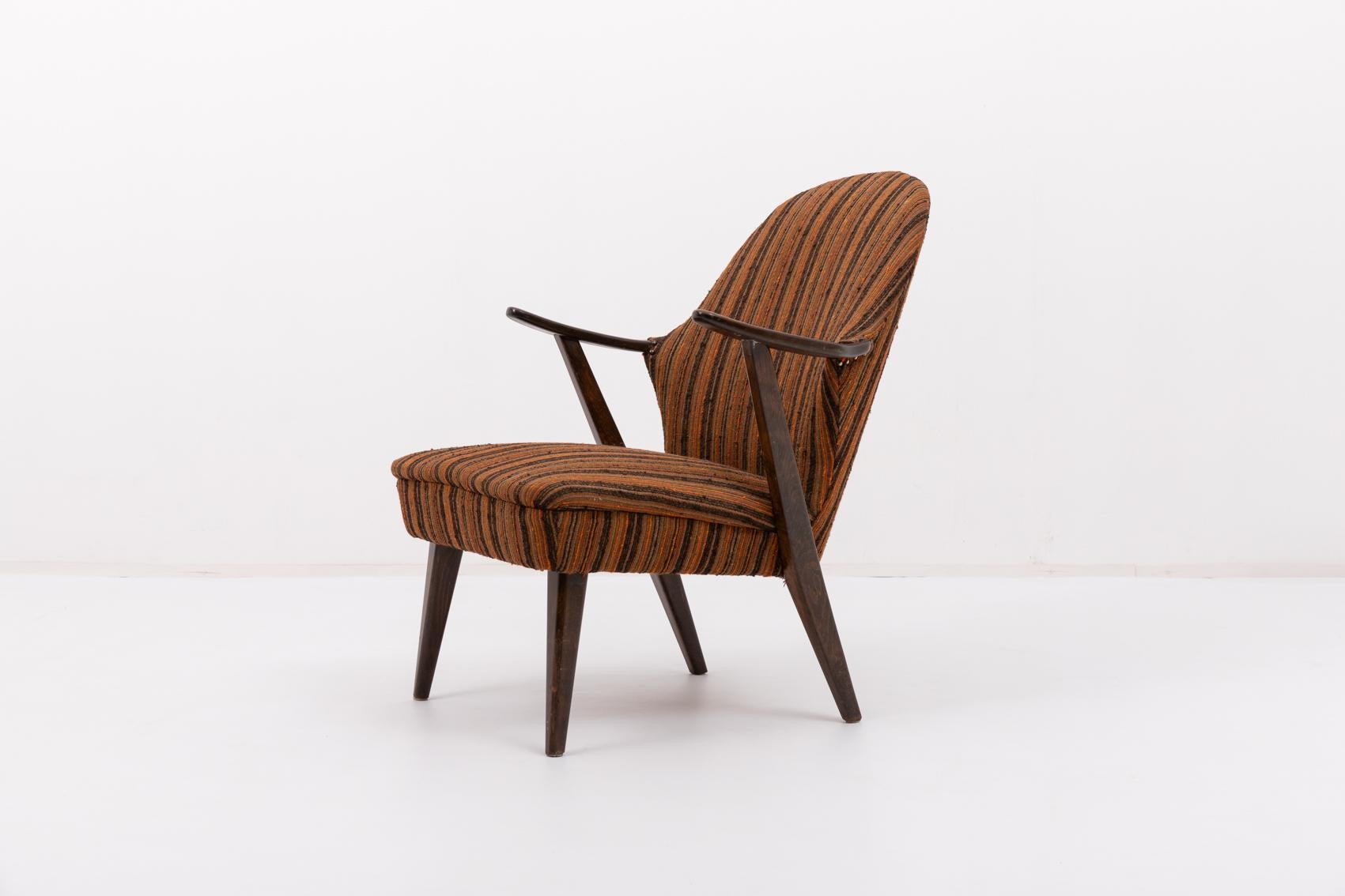Throughout the 1950’s-70’s Danish designer Arne Hovmand Olsen created furnishings that boasted all of the alluring qualities now associated with vintage Scandinavian modern design. This slender frame and sculptural seat back chair has original brown