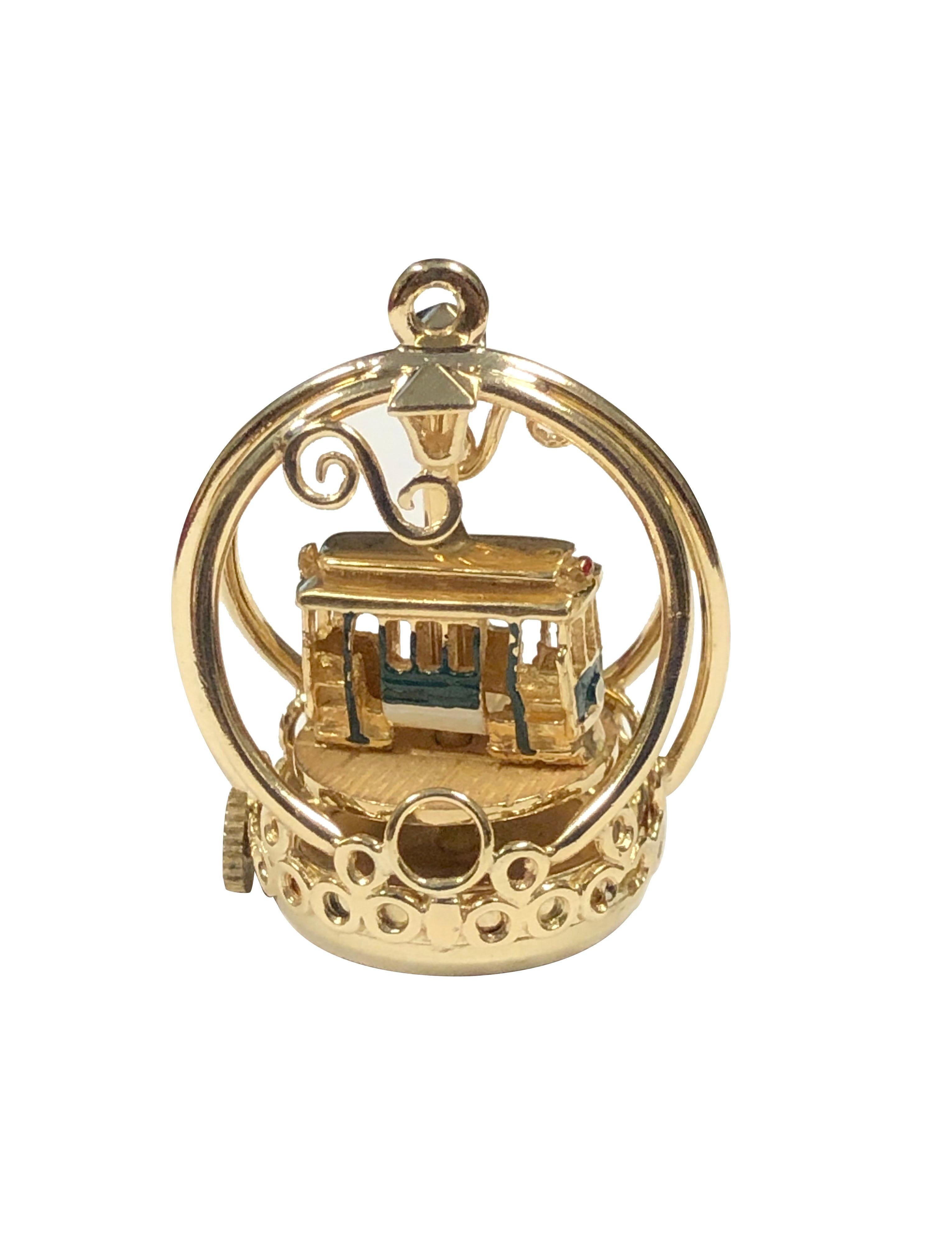 Circa 1960s Henry Dankner 14k Yellow Gold Whimsical Mechanical Street Car Charm, measuring 3/4 inch in diameter and 1 1/8 inch in height, weighing 16.3 Grams, very detailed with enamel, very detailed and recently having the mechanism serviced.  