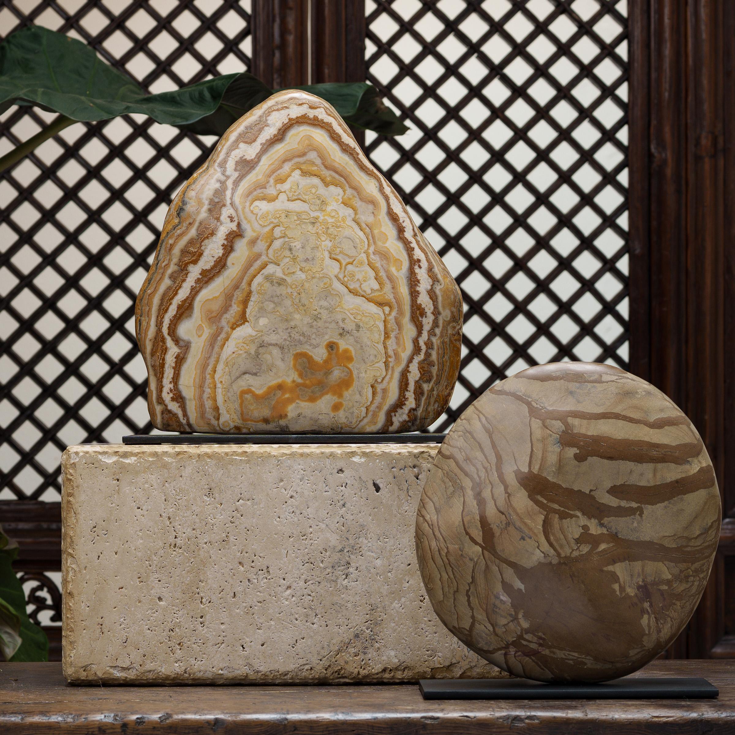 Following the sculpted form, marbled coloring, and natural veining of this one-of-a-kind stone can be deeply meditative. Viewed as a source of beauty and creativity, Chinese scholar-artists would decorate their studios and gardens with similar