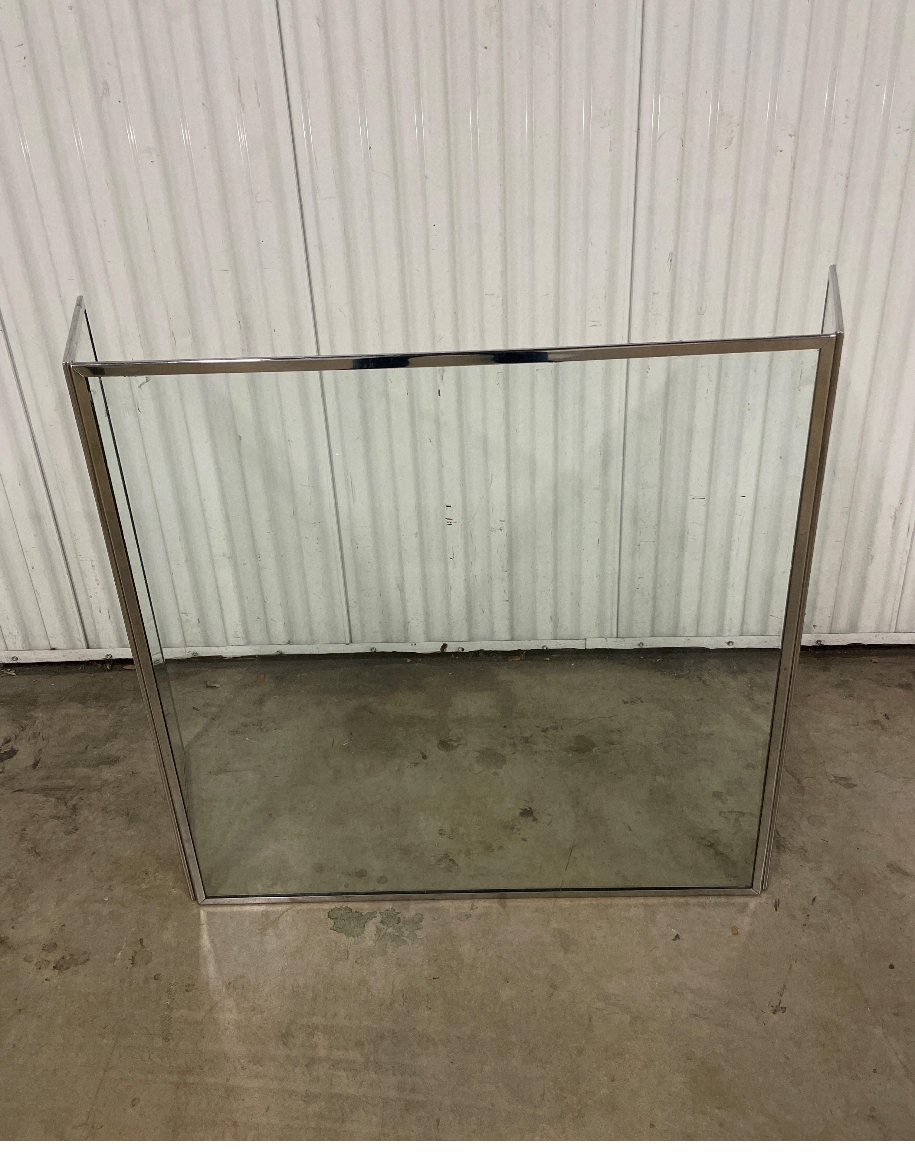 Classic chrome and glass fireplace screen by Danny Alessandro. The screen measures 30.25 inches high. The center portion is 30.25 inches & the two side panels are 13.25 inches each.