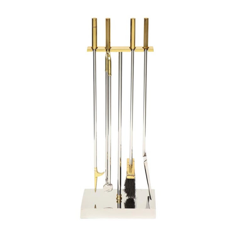 Danny Alessandro fireplace tools, brass, chrome. Quality built minimalist firetools with hexagonal handles and rectangular weighted stand. Mr. Alessandro's andirons, fire screens and fire tools were sold through his Upper East Side Manhattan