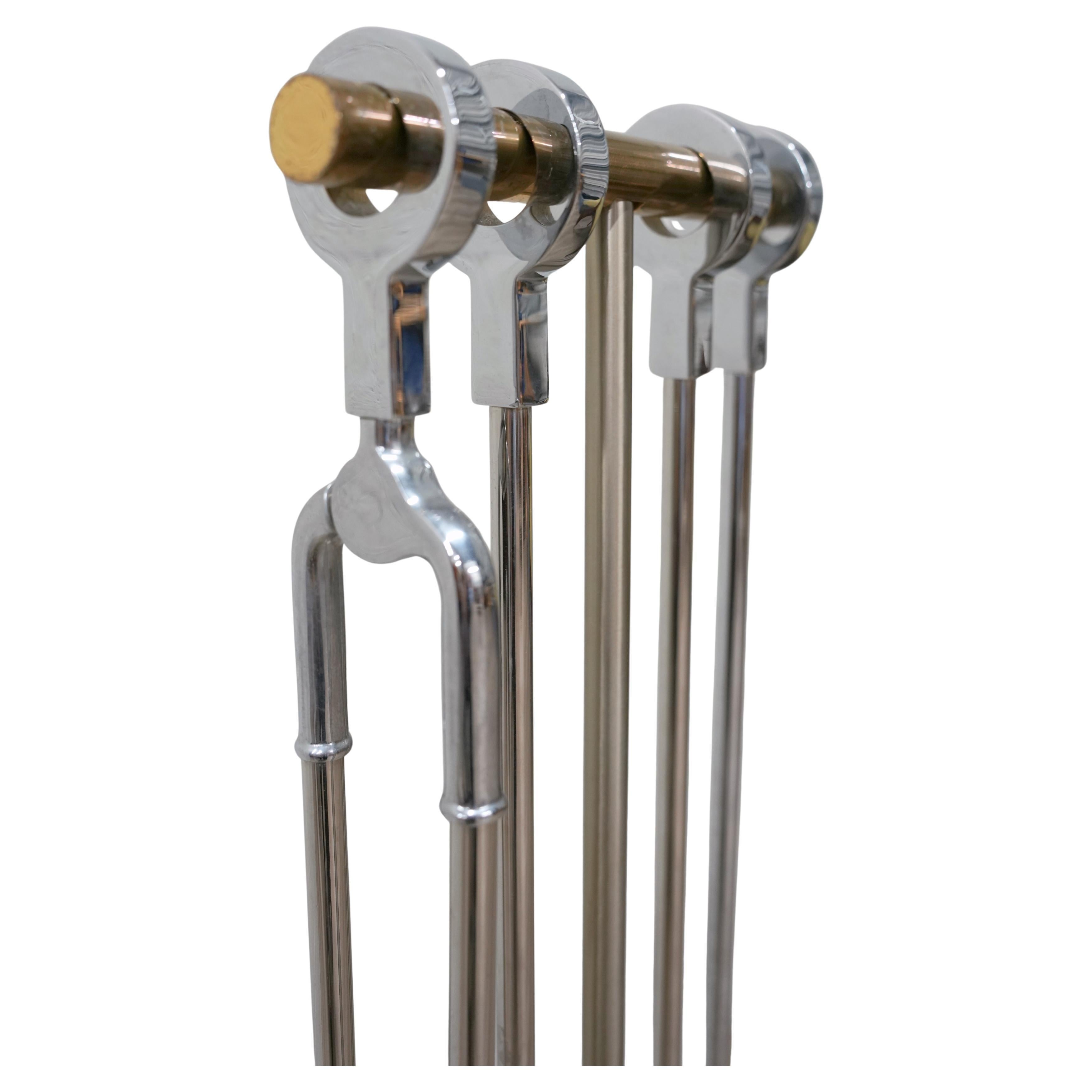 Danny Alessandro fireplace tools in nickel and brass, USA, 1980s. Quality cast fire tools with ring handles.
Alessandro sold his designs through Holly Hunt and his own showroom. Set includes four tools and the weighted stand. Matching pair of