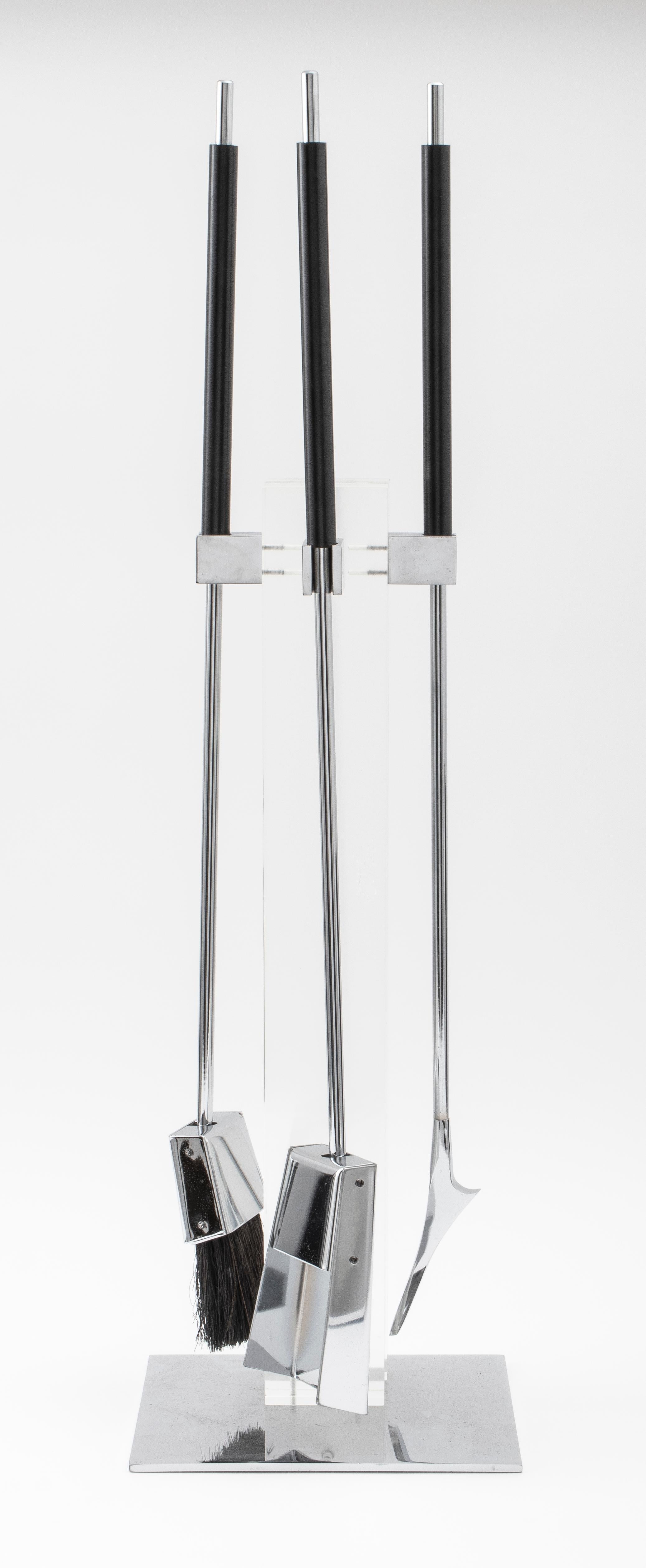 Danny Alessandro Modern contemporary lucite and chromed metal fire tools, with resin handles, includes shovel, brush and poker.

Measurements: 35