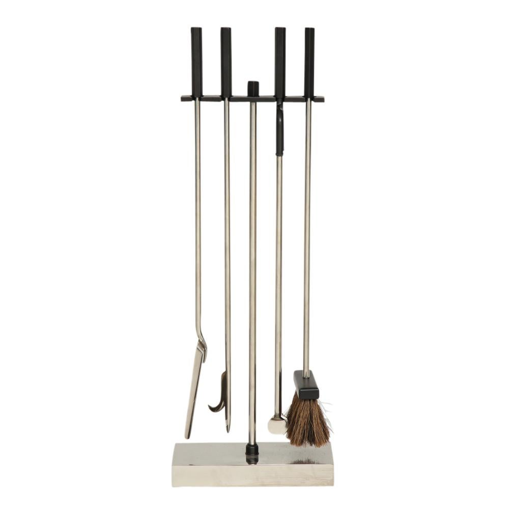 Danny Alessandro fireplace tools, matte black and nickel chrome. Quality built minimalist firetools with hexagonal handles and rectangular weighted stand. Mr. Alessandro's designs were sold through his Upper East Side Manhattan storefront.


   