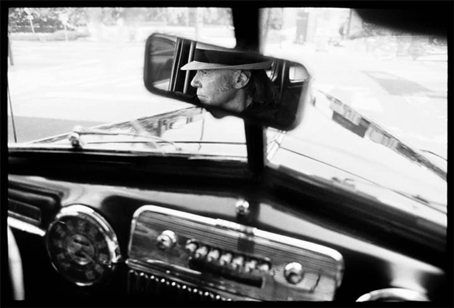 Danny Clinch Black and White Photograph - Neil Young in Rearview Mirror