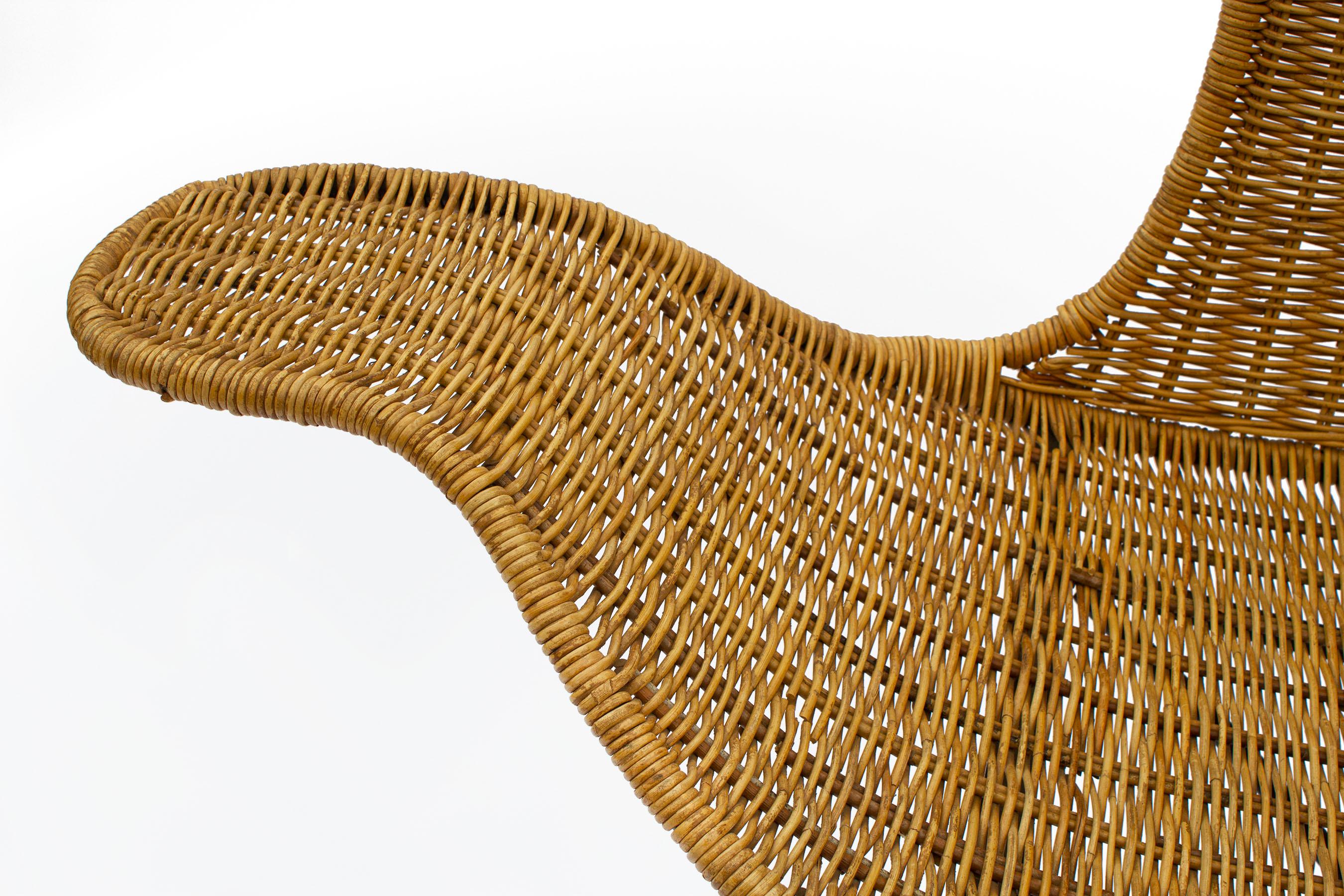 Danny Ho Fong designed this wave chair for Tropi-cal in the late 1960's. It consists of a steel frame and hand woven rattan. Its organic nature makes it perfect for a space that needs a little texture and a lot of sculptural quality. 

 It bears a