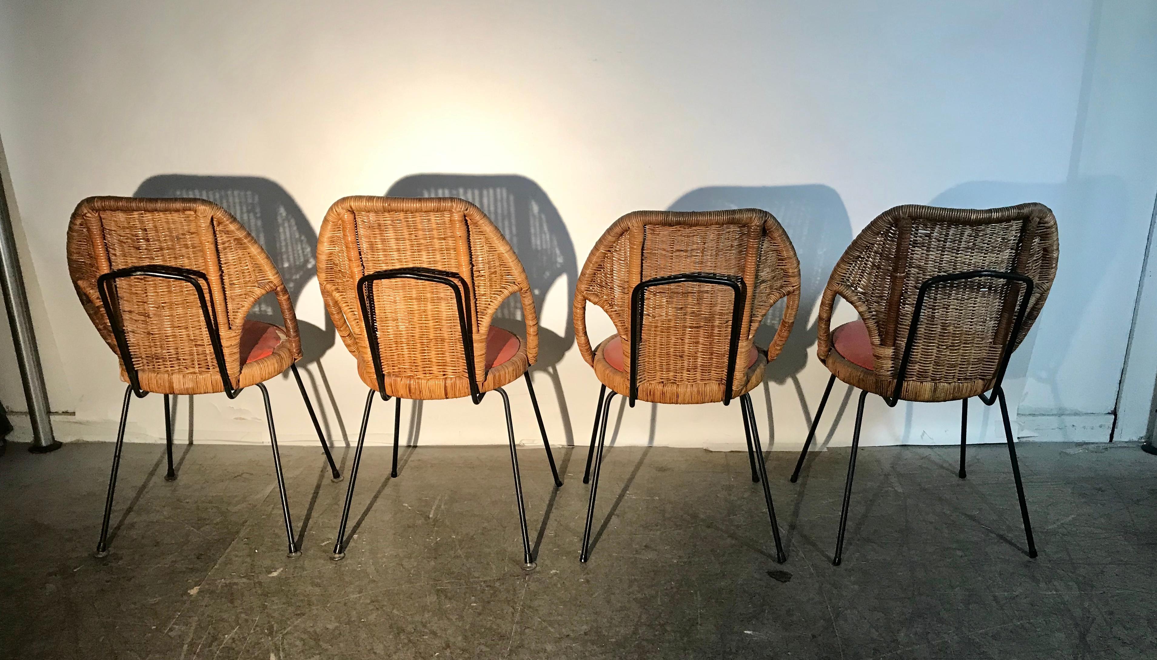 Danny Ho Fong, wicker and iron dinette chairs for Tropical, great set. Retains original orange Naugahyde seats. One seat has a tear. Extremely comfortable, Indoor or outdoor. Retains original Tropical labels.
