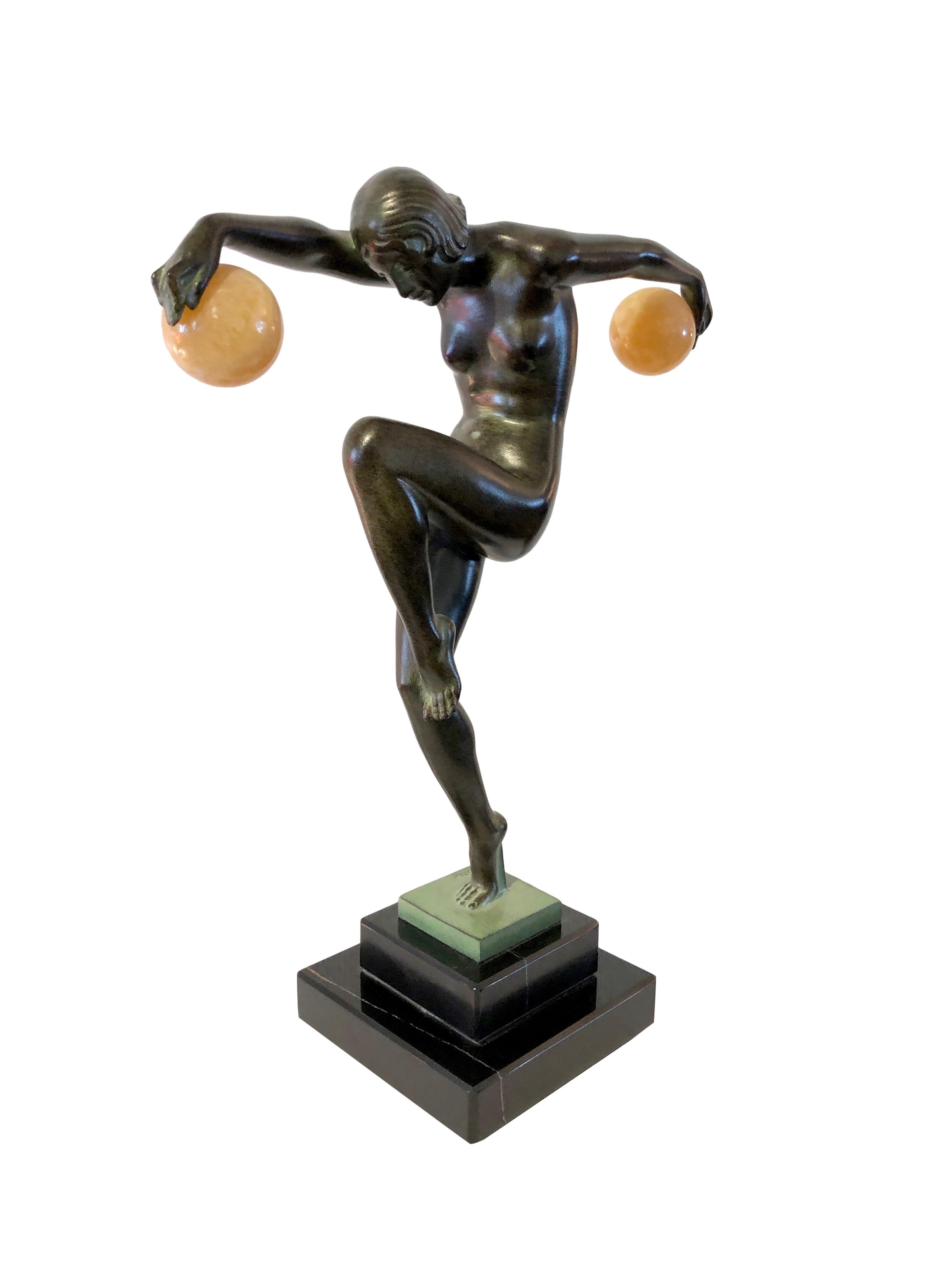 Sculpture dancing lady 
Danseuse Aux Boules, Ball dancer 
Designed in France during the roaring 1920s by “Denis”
Original Max Le Verrier, signed 
Art Deco style, France

Material: 
Régule (Spelter) 
Green patina, handwork, so patina could be