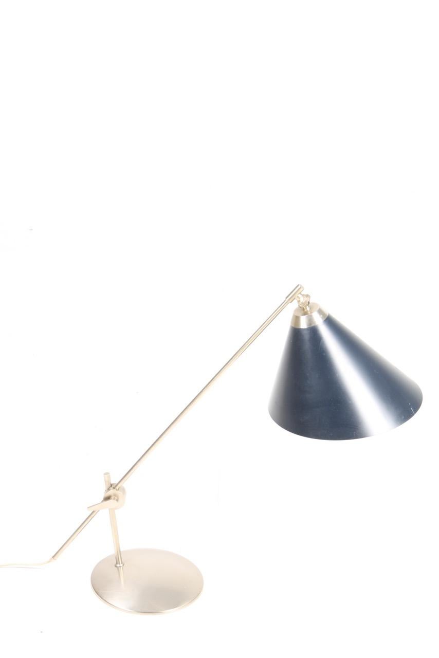 Great looking adjustable table lamp in chromed metal. Made by Povl Dinesen in the 1960s. Made in Denmark.
