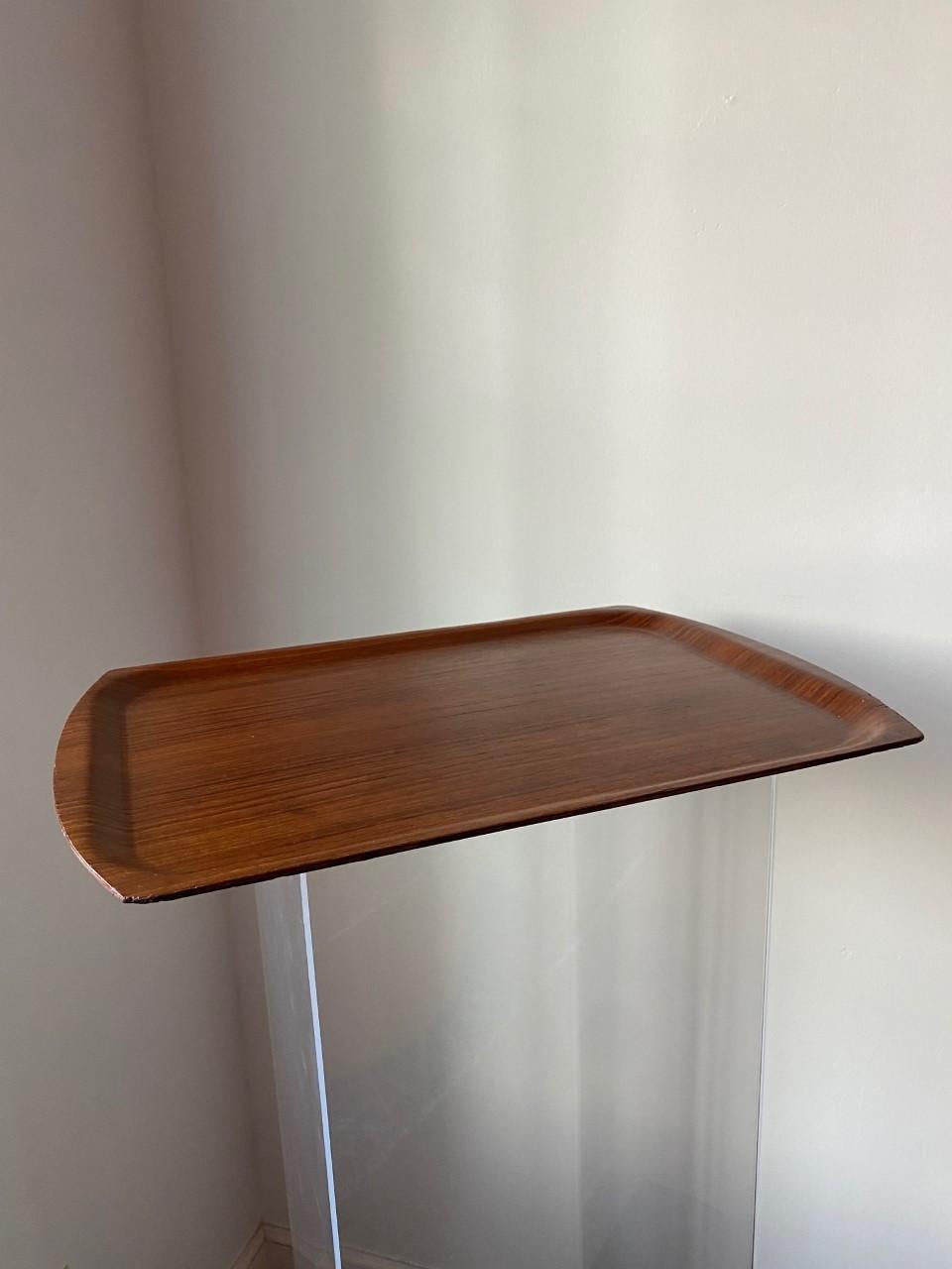 Danish Dansk teak tray which teak with stunning wood grain. Tray doesn't have Dansk marking on the underside but came in its original box at one point. Made in Denmark signature engraved. Piece obtain in Denmark.


Excellent design that would