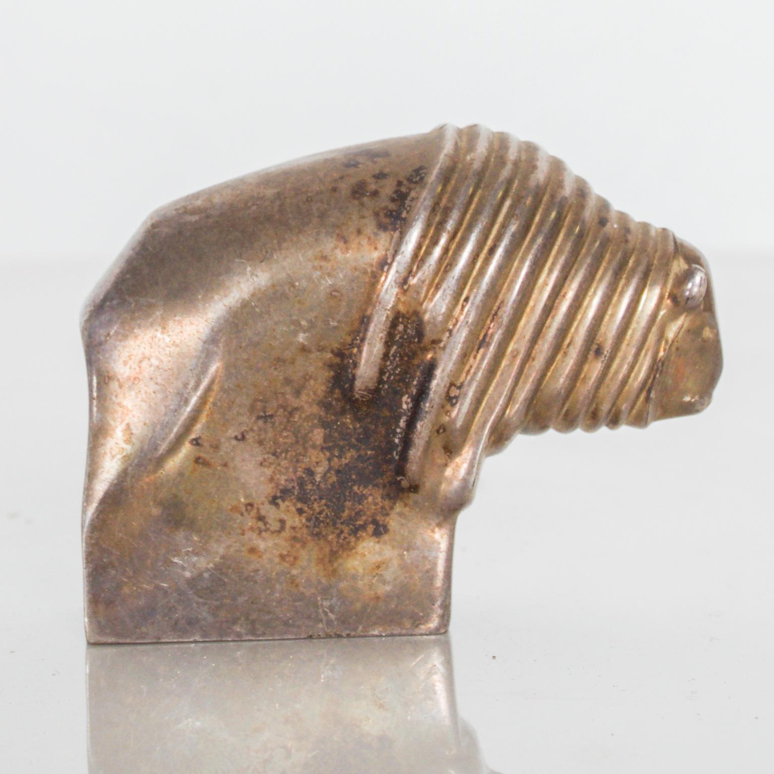 We features: Too cute Dansk Bison paperweight in silver plate Danish Modern DANSK Designs a vintage Mid-Century Modern piece.
Japanese silver-plated Bison paperweight by Dansk International Designs. Marked on underside.

Dimensions: 2 1/4