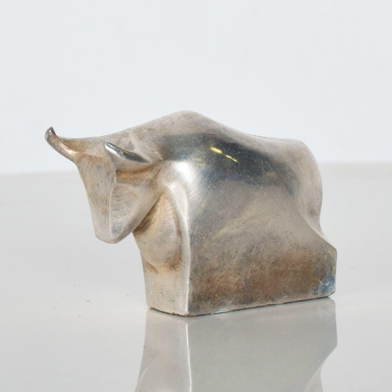 For your pleasure: Danish Modern Dansk Designs Bull paperweight in silverplate from midcentury TORO in silver

Japanese silver-plated bull paperweight by Dansk International Designs. Marked on underside. (See our matching Hippo Paperweight by