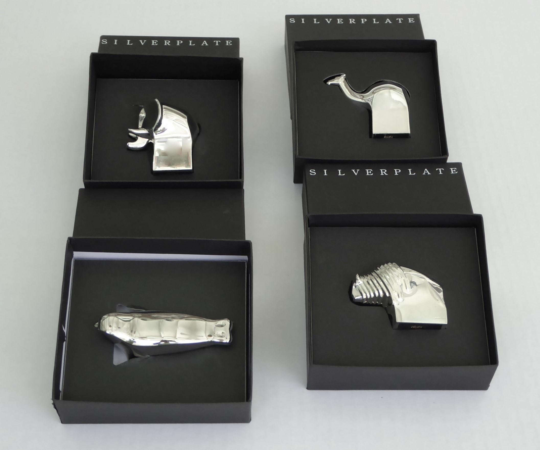 World renowned Danish designer Gunnar Cyren created these decorative silver plated animal paper weights for Dansk Designs in the 1970s. In this grouping you will find an elephant, a seal (Nickel-plated), a Giraffe and an American Bison all in their