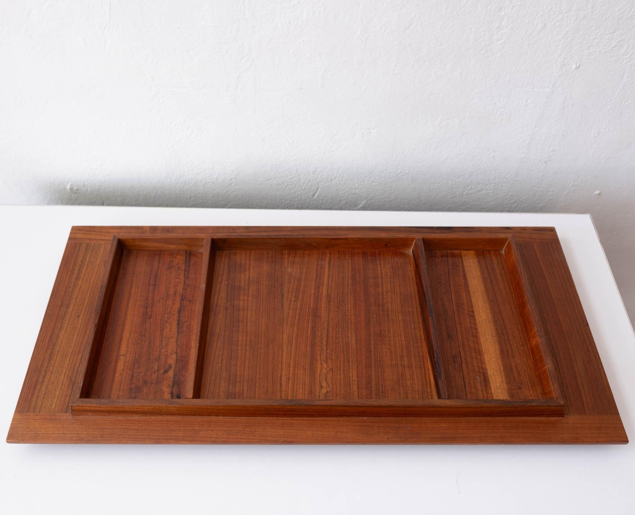 Dual sided tray designed by Jens Quistgaard for Dansk. Constructed of teak with a butcher block section and other divided sections. 

Denmark, 1960s.