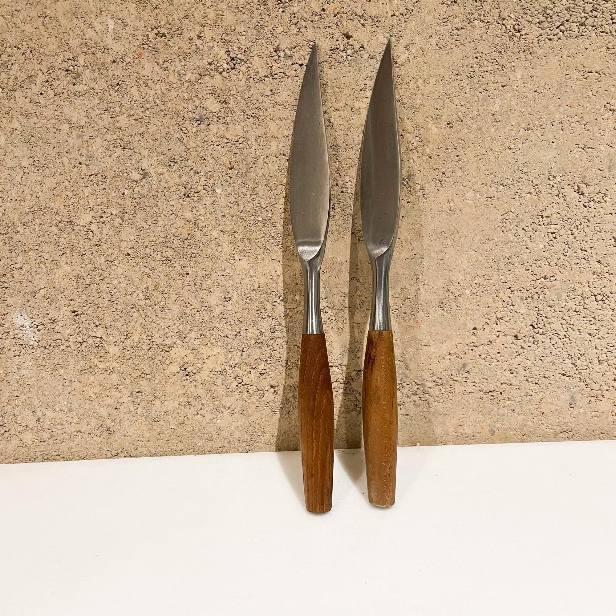 Set of two steak knives
Dansk Fjord Designs from Germany by Jens Quistgaard designed 1954
Maker stamped.
Original unrestored preowned use vintage condition. See our images please.
Designed in Teak Wood and Stainless Steel
Measures: 8.5 L x .63