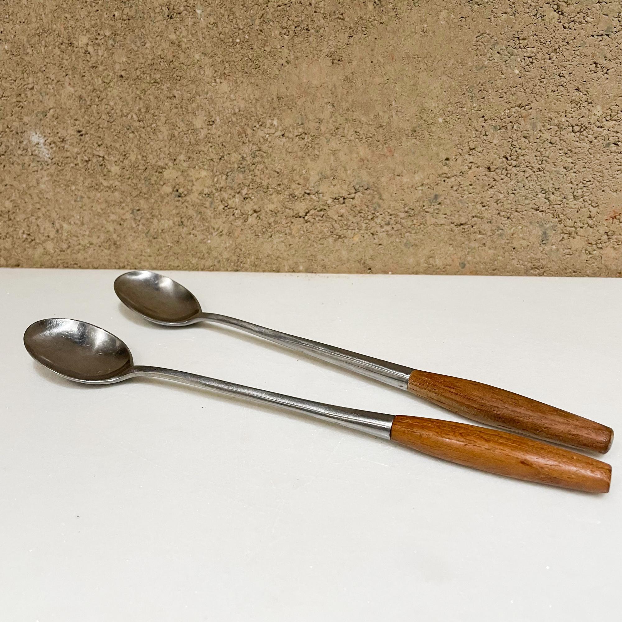 Two long bar cocktail spoons ice tea spoons
Dansk IHQ Fjord designs from Germany by Jens Quistgaard designed in 1954
Maker stamped.
Original unrestored preowned use vintage condition. See our images please.
Designed in teak wood and stainless
