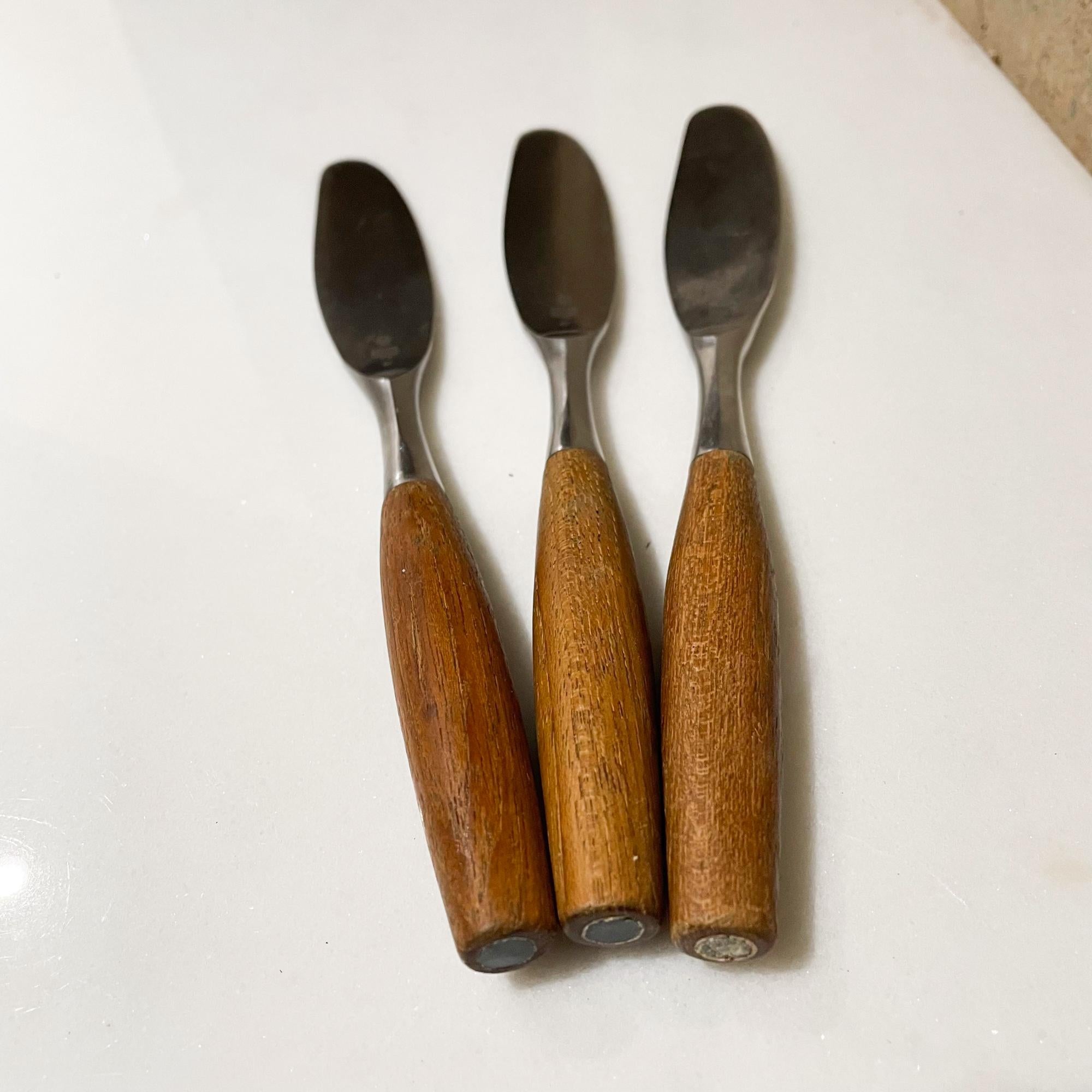 Three Dansk Knives 
Dansk IHQ Germany Set of Three Knives Teak & Stainless Fjord Flatware 1954
Made in Teak Wood and Stainless Steel Designed by Jens Quistgaard for Dansk IHQ
8.25 L x .88 w x .5 thick inches
Maker stamped.
Original unrestored