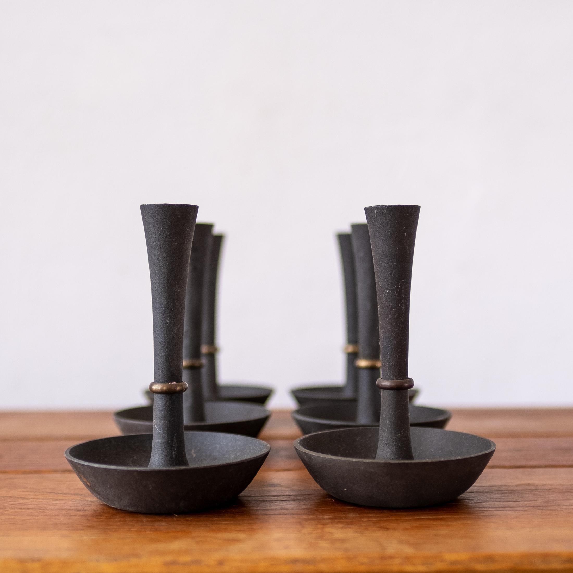 Set of six Dansk iron and brass candle holders by Jens Quistgaard. This design is part of the first series of iron 
 candle holders designed by Quistgaard. According to the monograph on Quistgaard, they were only produced for a short time. Denmark,