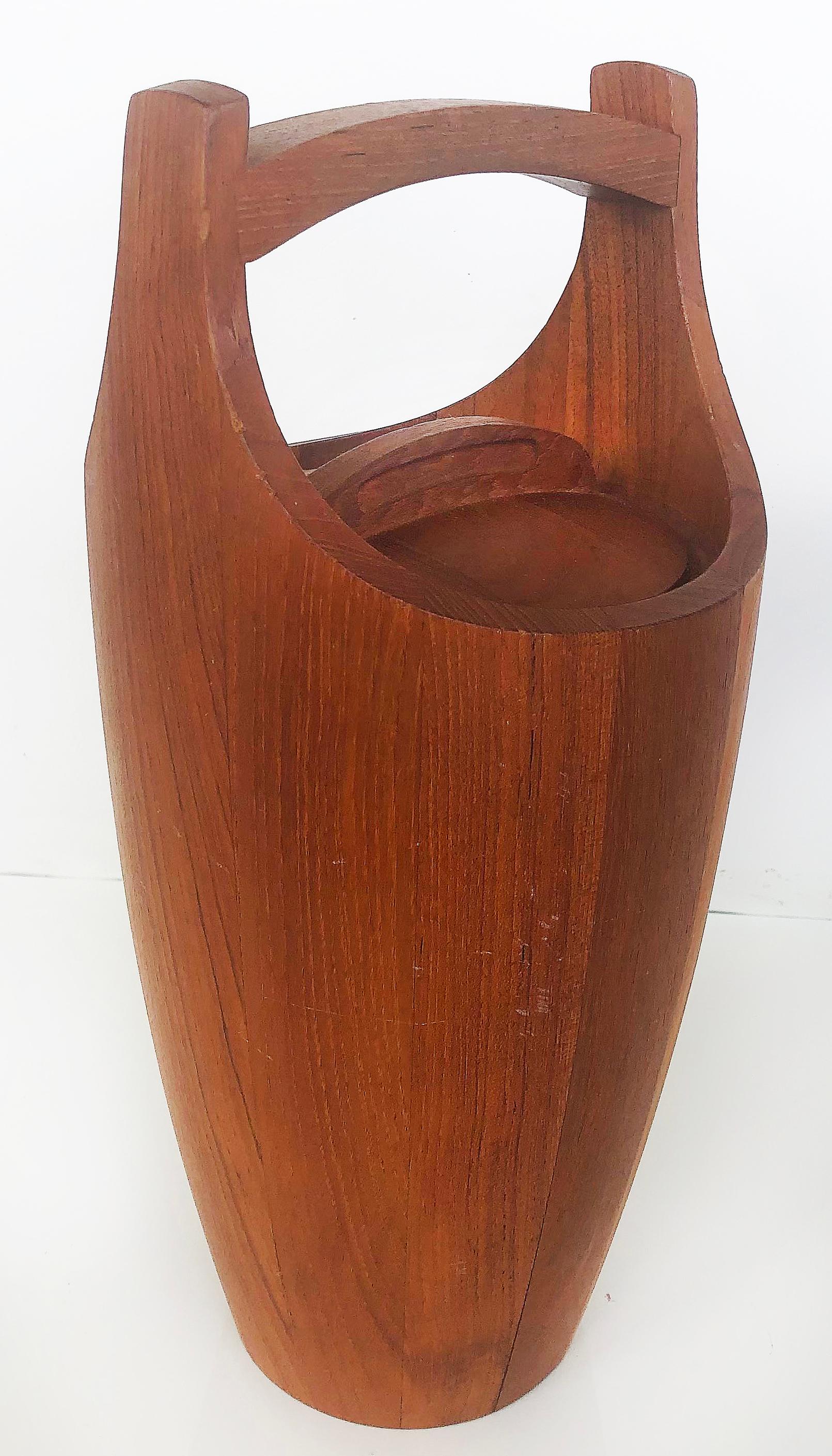 Dansk Jens Quistgaard Mid-Century Teak Ice Bucket, Large

Offered is a Classic Dansk Jens Quistgaard large Mid-Century Modern teak ice bucket with original top and plastic liner. This ice bucket is in excellent vintage condition and has the Dansk