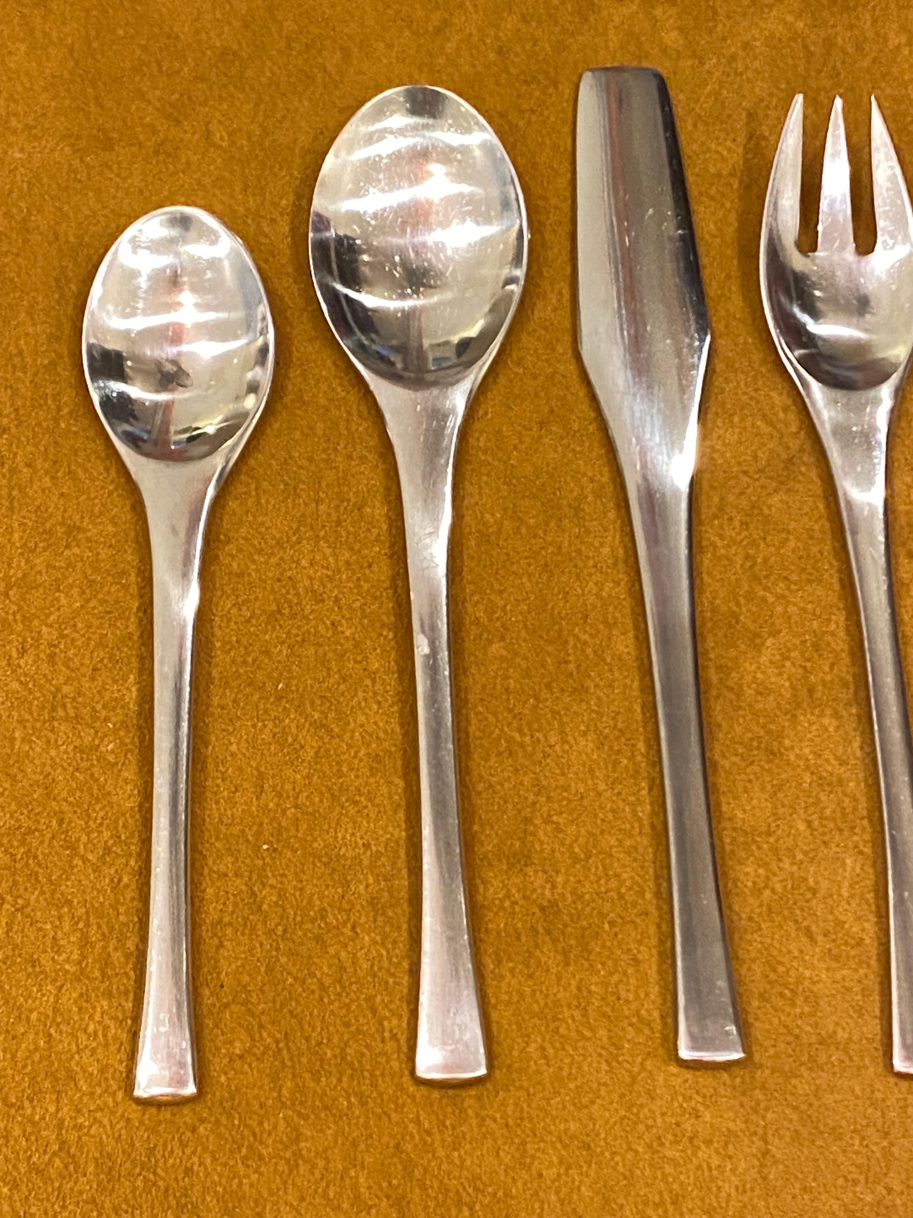 Jens Quistgaard for Dansk Odin Stainless Flatware Set.  Service for 10 plus extras.  All pretty clean!  A few of the extra knives show minor pits but there are 10 pretty good ones.  I show one of the lesser ones which I'm including!  Nice scale and
