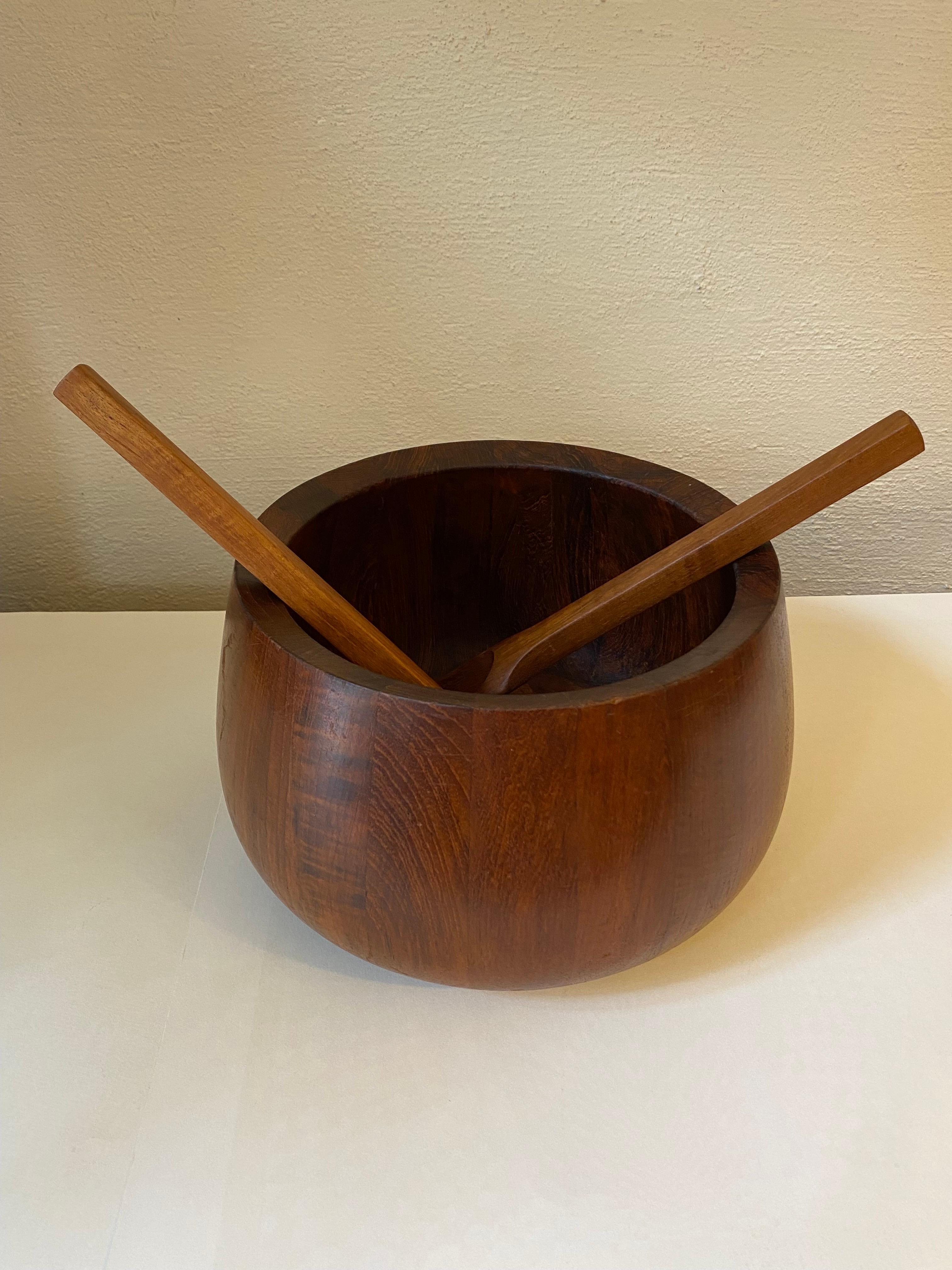 Large deep salad bowl and serving tools designed by jens Quistgaard and sold through Dansk. Solid teak, signed to bottom. Salad spoons are hard to find! Very nice complete set!