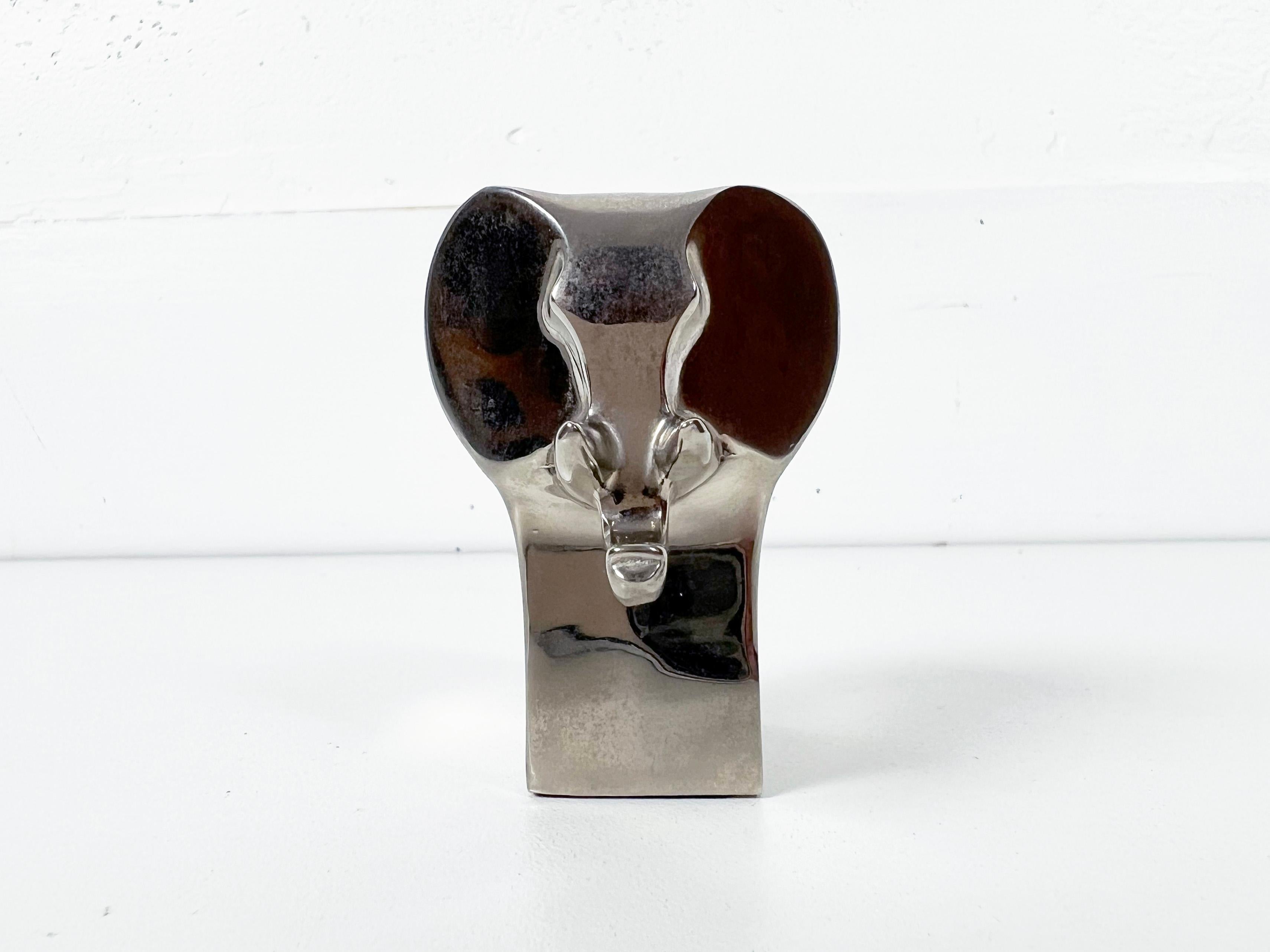 Vintage silver-plate elephant figurine/paperweight by Dansk.

Manufacturer: Dansk

Origin: Japan

Year: 1970s

Dimensions: 2.25