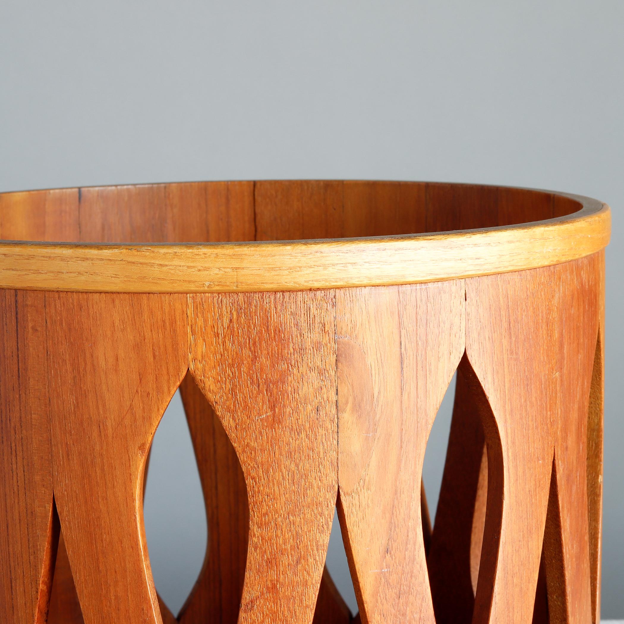Staved teak waste paper basket designed by Jens Quistgaard for Dansk. Made in Denmark, circa 1958. In a period newspaper article, it was noted that this 'teak stool can double up as a table or be turned upside down as a wastepaper