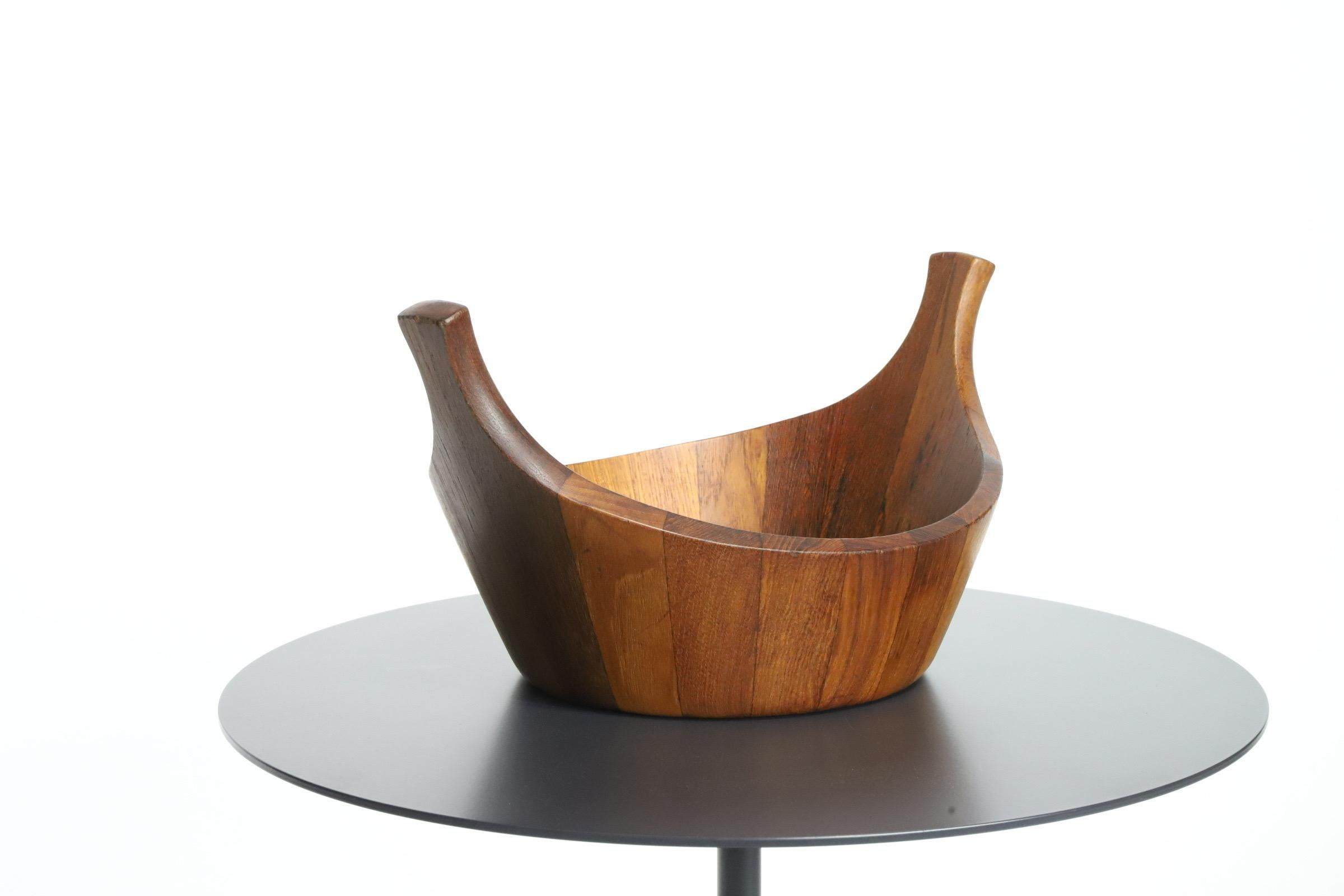  Introducing a timeless classic - the Dansk Teak Staved Viking Salad Bowl, designed by the legendary Jens Quistgaard.

Crafted with utmost craftsmanship and attention to detail, this iconic salad bowl exemplifies the epitome of mid-century modern