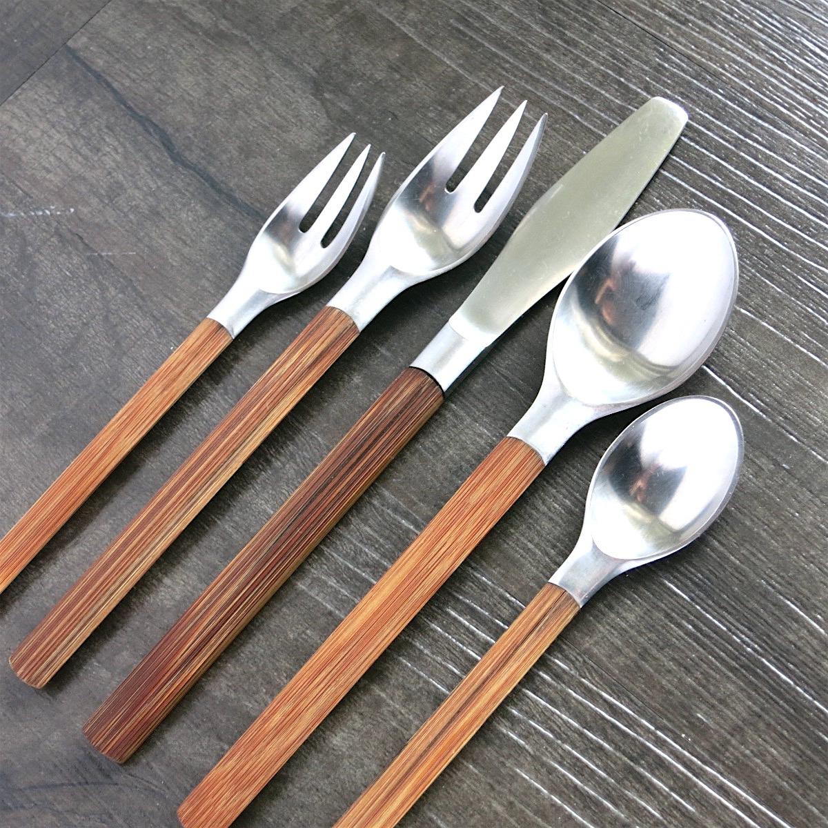 Dansk bamboo-handled stainless steel flatware service for four in the Toke pattern, designed by Jens Quistgaard in the late 1950s. The production of this pattern was limited to just a few years (probably 1959-1960 or so) and was complemented by the
